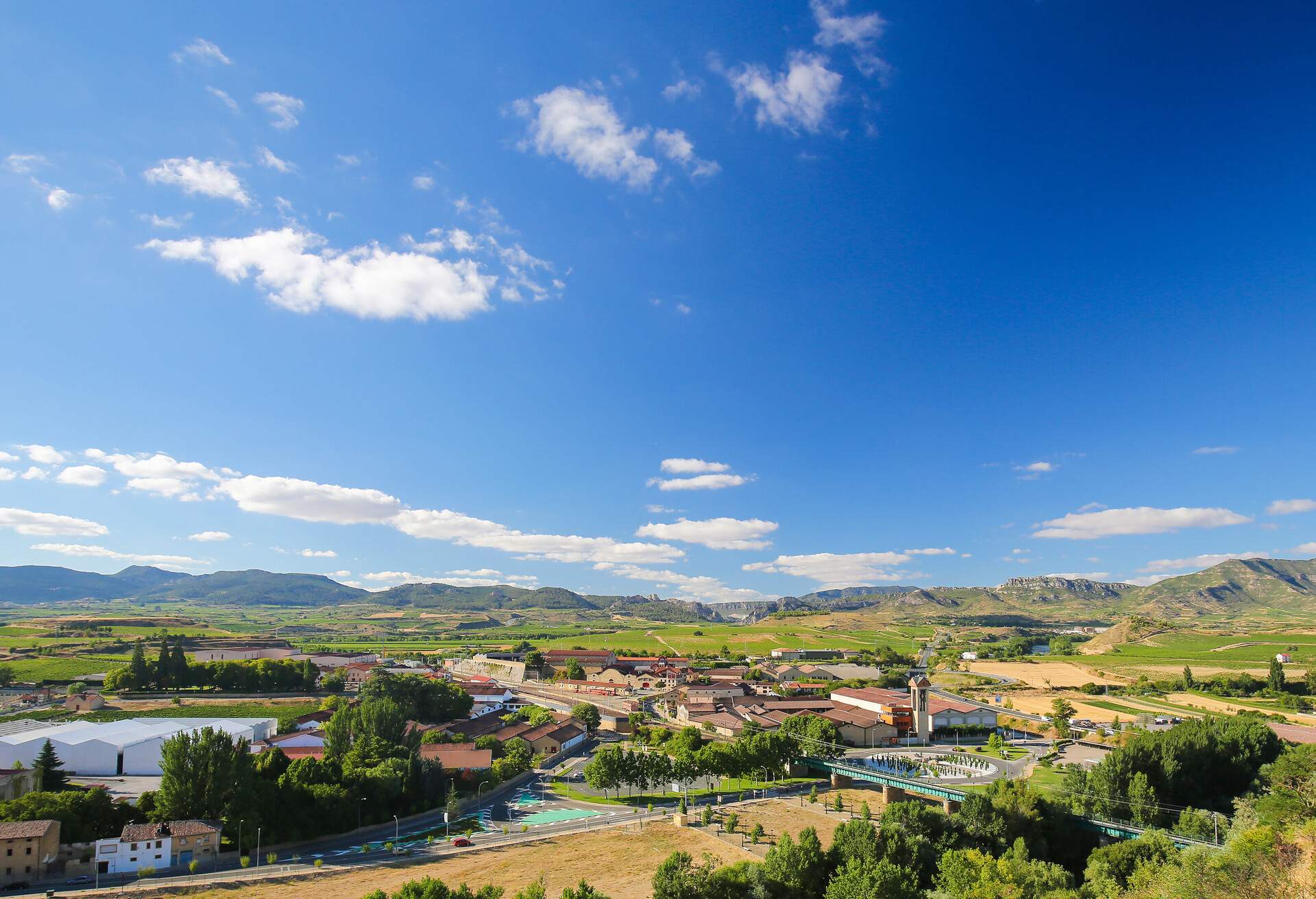 View on the famous bodegas or wine houses and vineyards of the Rioja Alta wine region near Haro, La Rioja, Spain