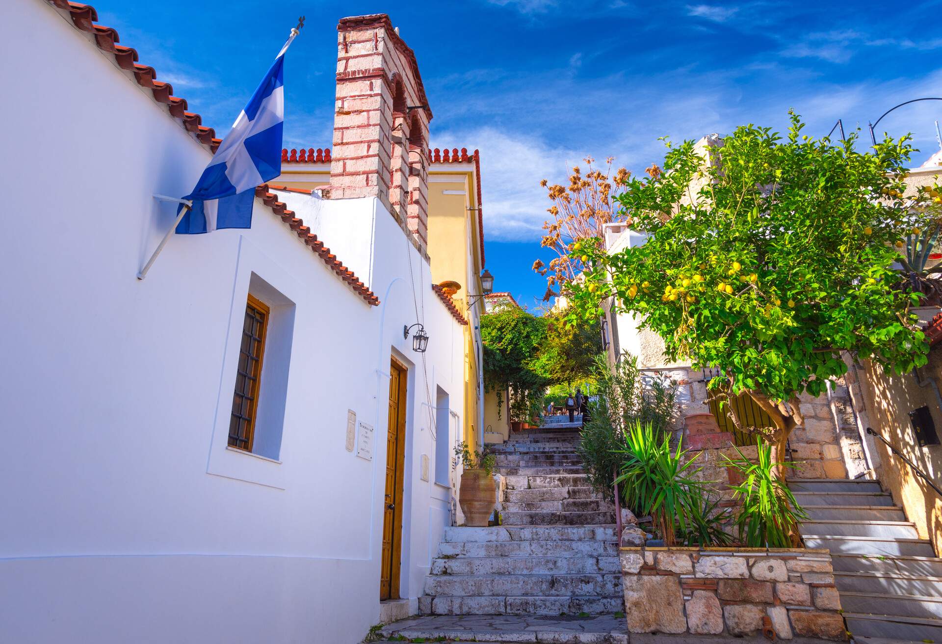 Street of Anafiotika in the old town of Athens, Greece. Anafiotika is district built by workers from the island Anafi. Popular tourist attraction.; Shutterstock ID 1007588293