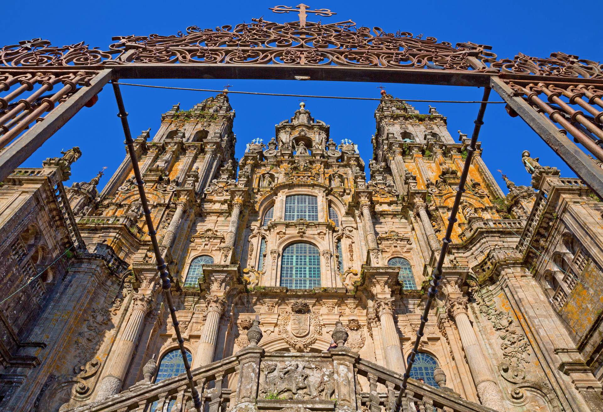 Facade of Cathedral of Santiago de Compostela with blue sky and grille; Shutterstock ID 106286825; Purpose: Blogs; Brand (KAYAK, Momondo, Any): ANY