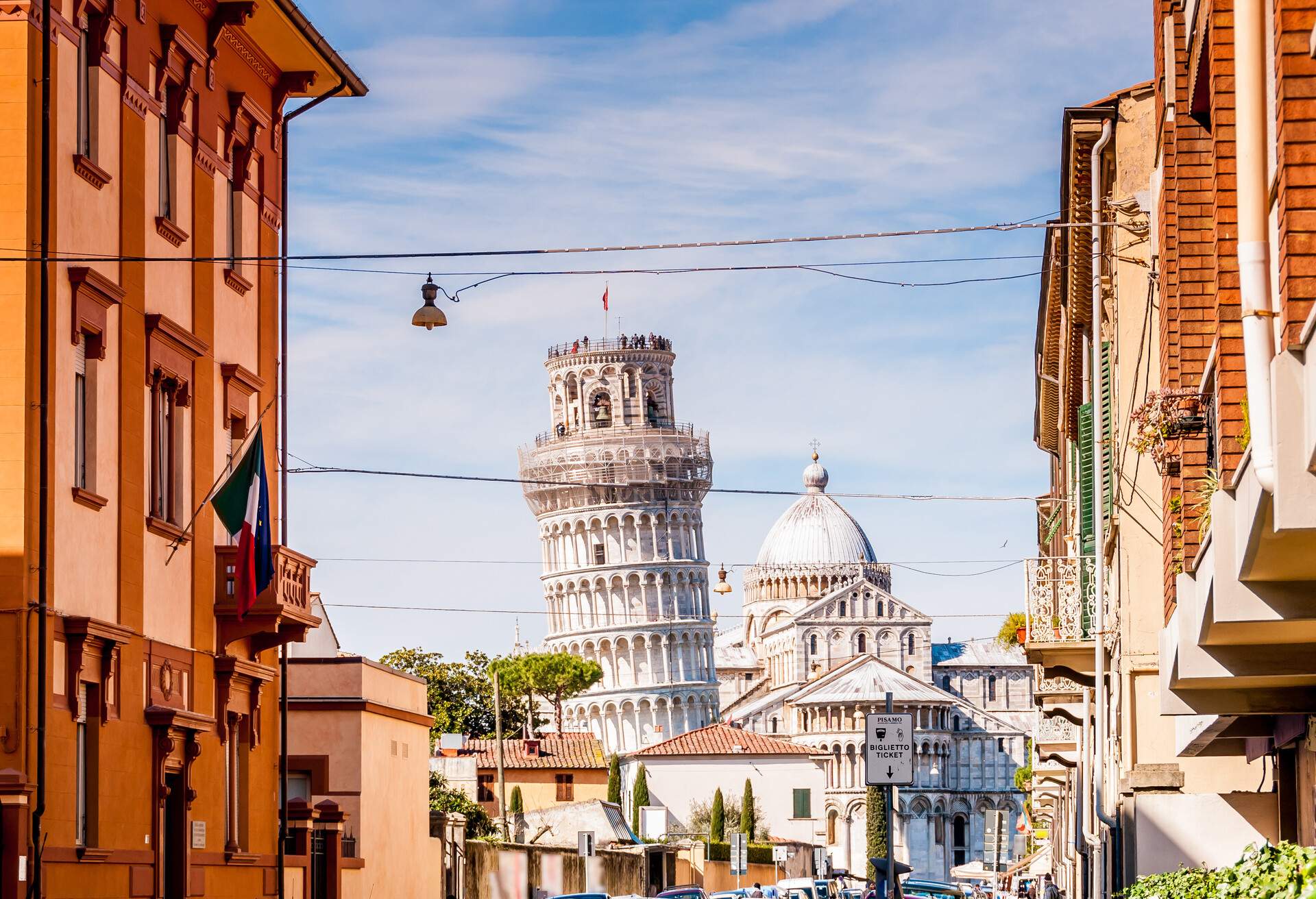 Pisa street with Campanile and cathedral in the distance, Tuscany in Italy; Shutterstock ID 1072547501