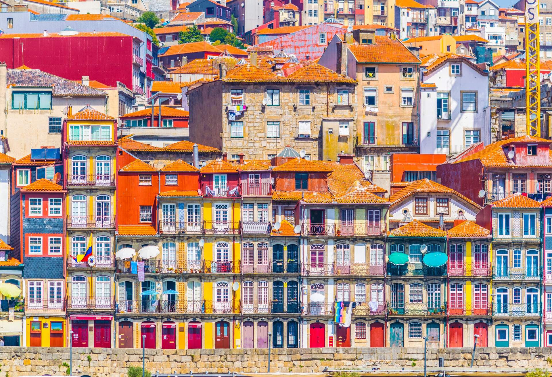 DEST_PORTUGAL_PORTO_Close up of colorful homes on water-shutterstock-premier_764921260
