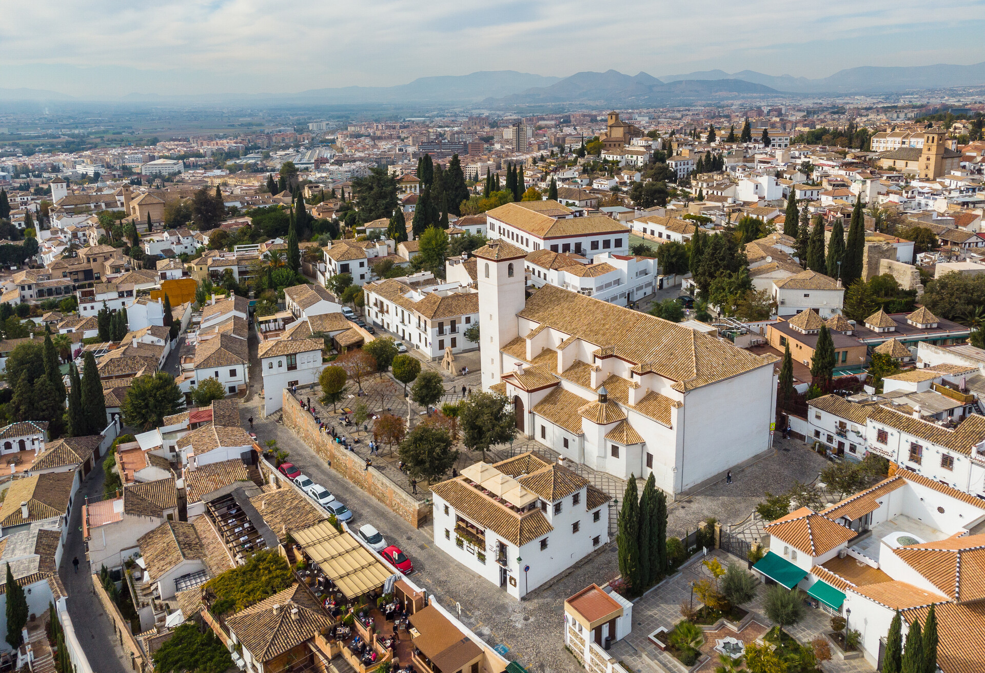 Aerial view of the famous  Mirador de San Nicolás church, a viewpoint on the Alhambra, in Granada old town in Andalusia in southern Spain