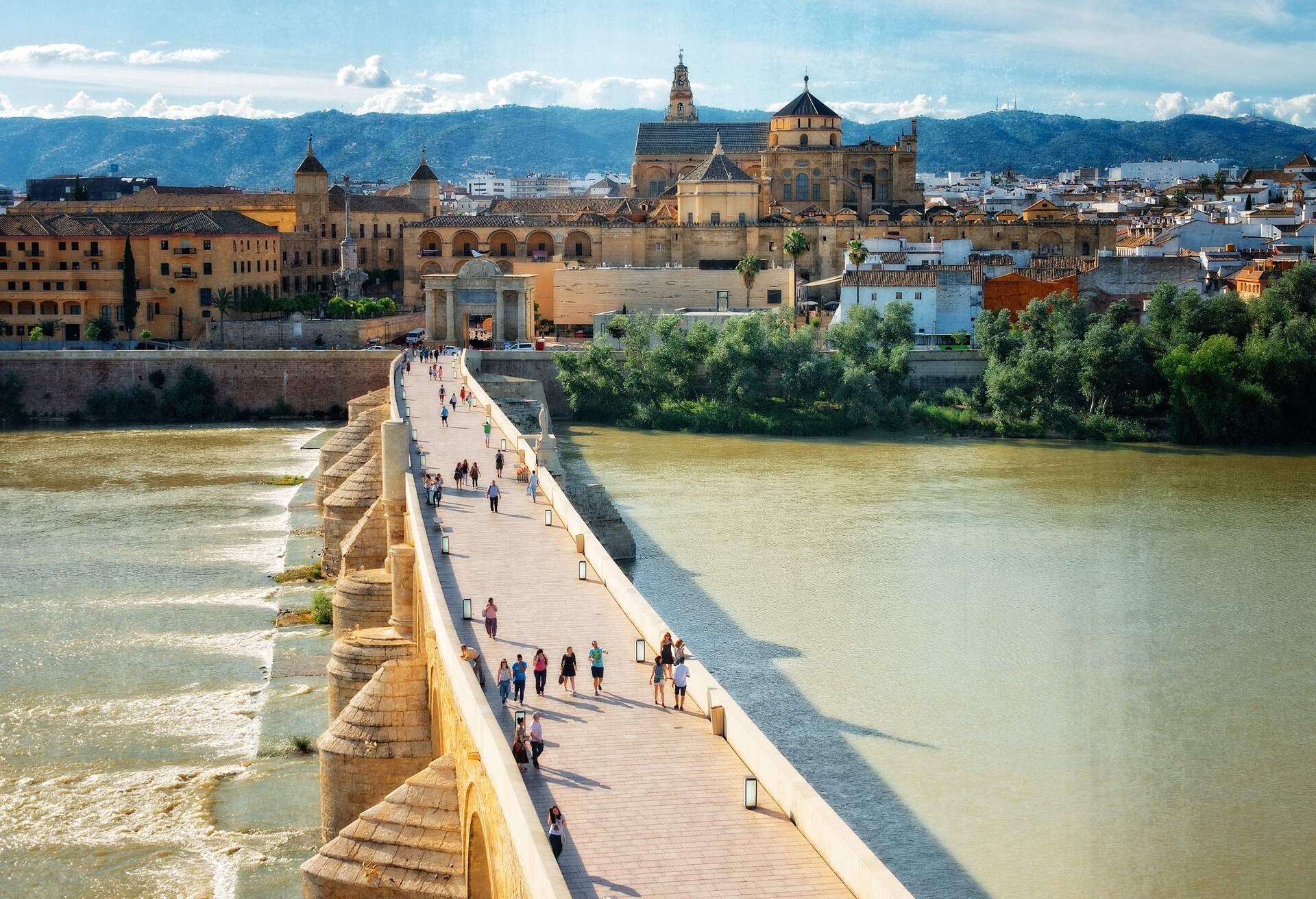 People on the bridge in Cordoba, Spain.