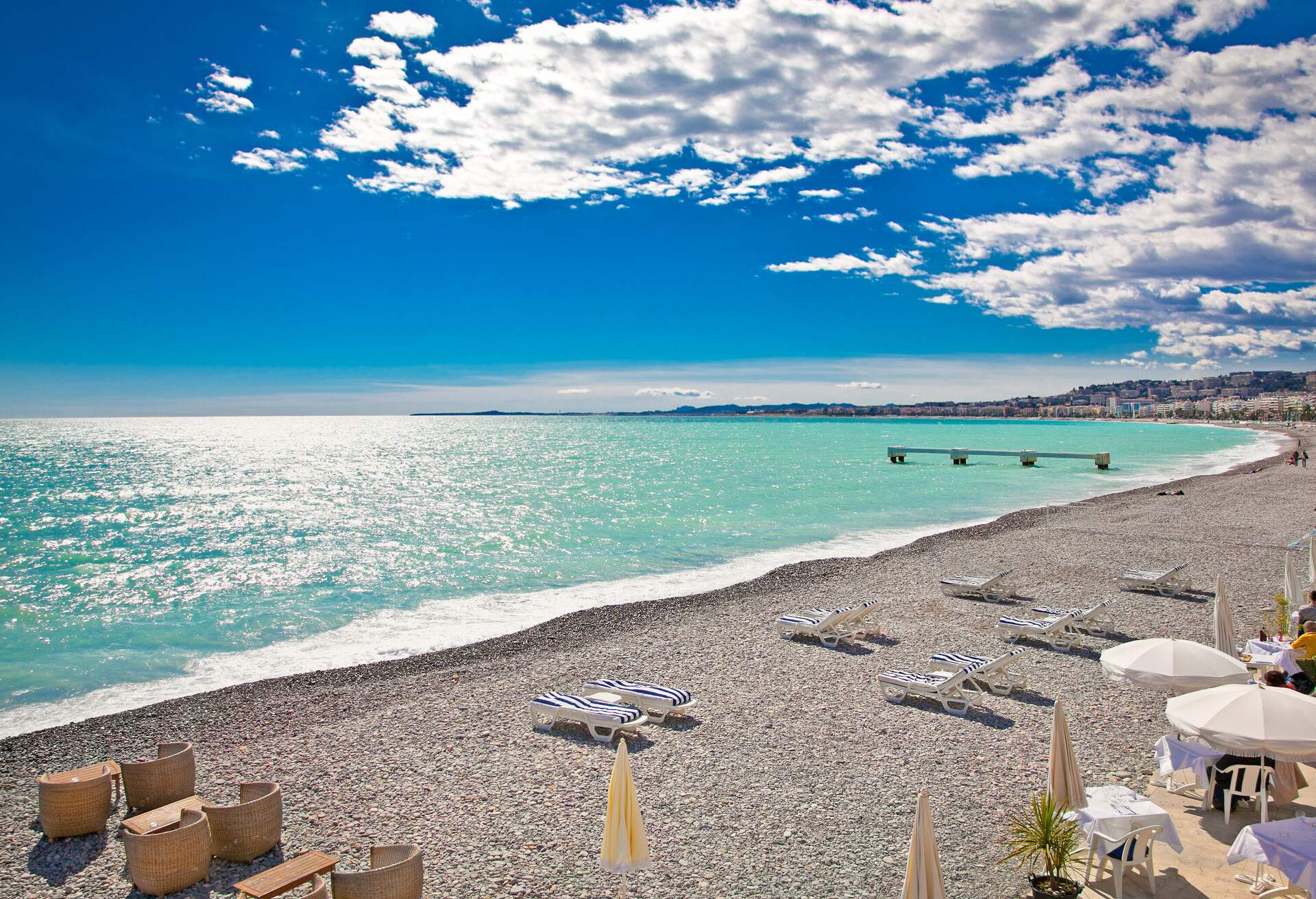 View of the beach in Nice, near the Promenade des Anglais, on summer hot day, France.; Shutterstock ID 185561138; Purpose: Newsletter; Brand (KAYAK, Momondo, Any): Any