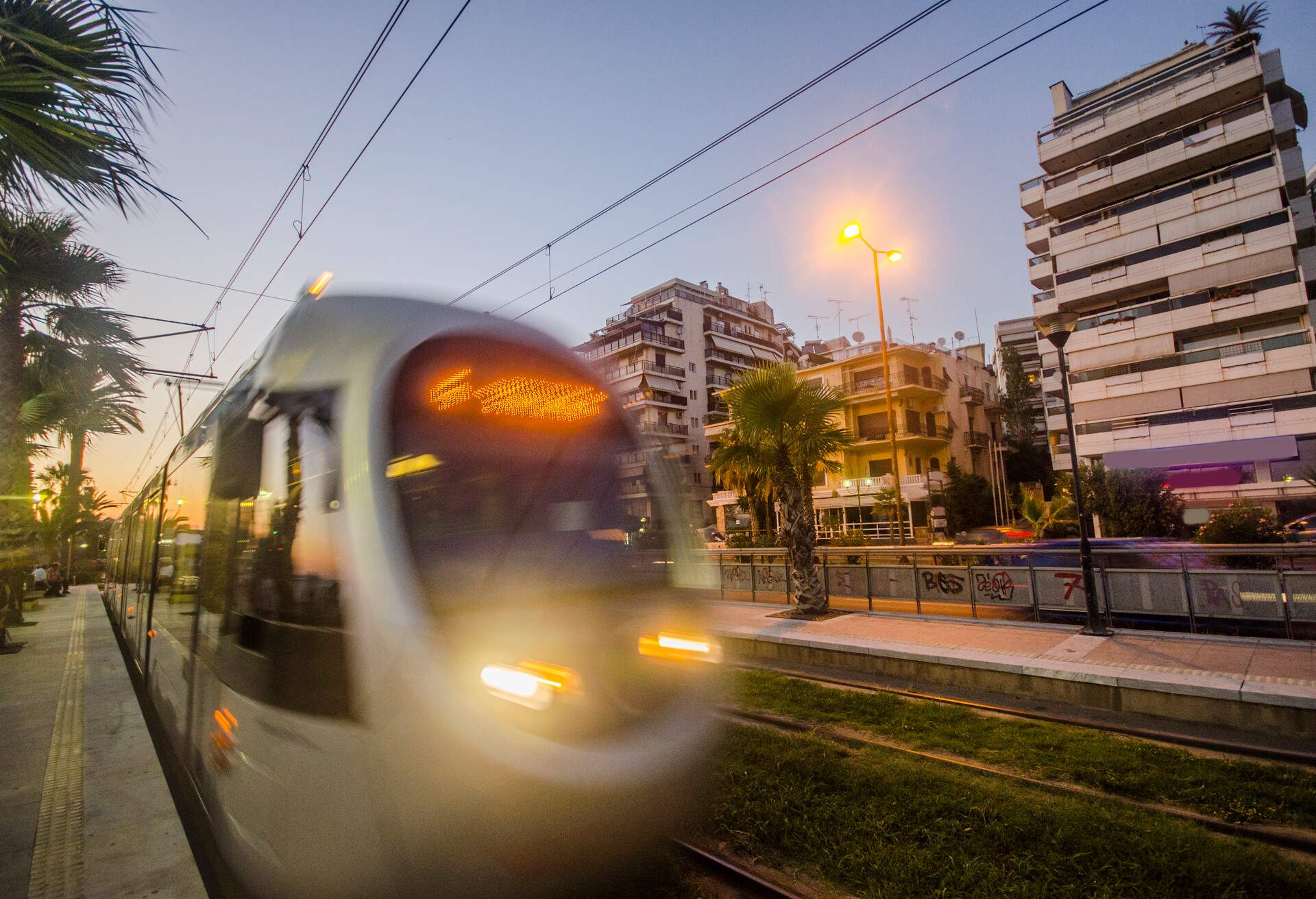 An Athens tram at sunset near Faliro district.