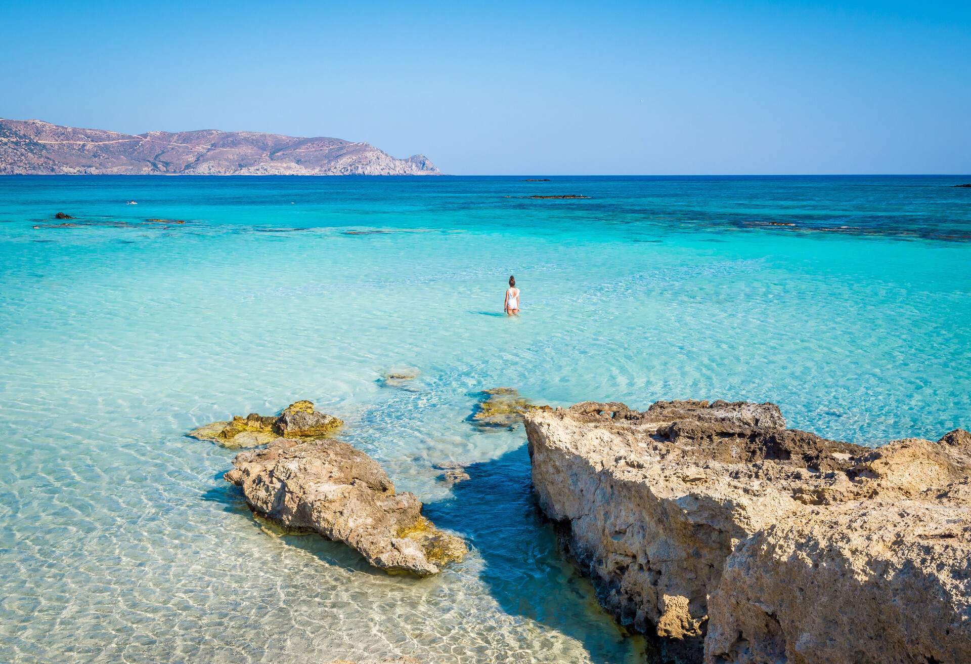 Crete, Greece - Jul 14, 2018: Elafonisi, a paradise beach with turquoise water, an island located close to the southwestern corner of the Mediterranean island of Crete, known for its pink sand beaches