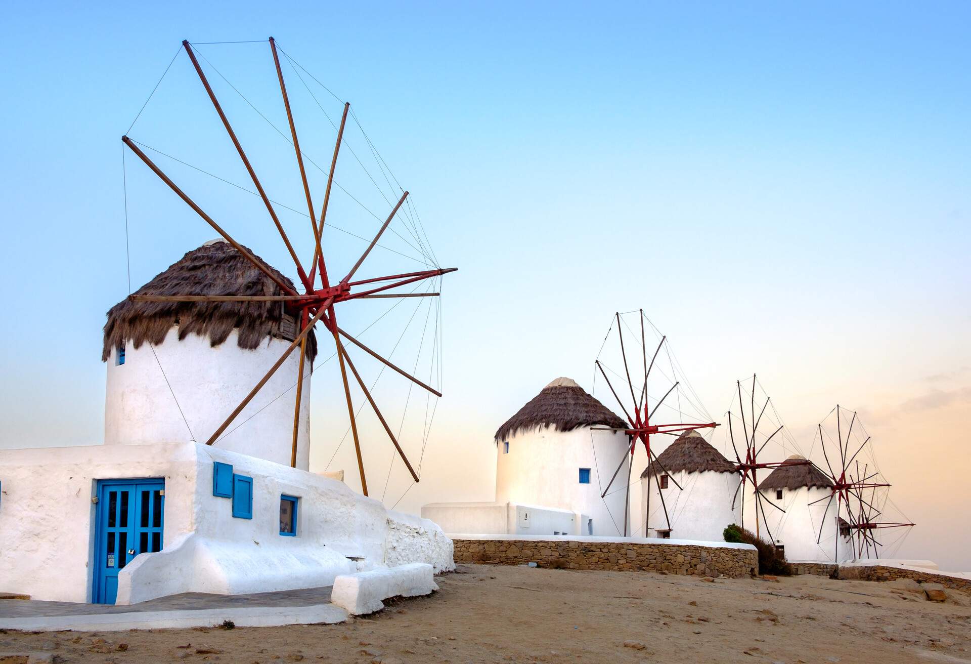 Scenic view of traditional greek windmills on Mykonos island at sunrise, Cyclades, Greece