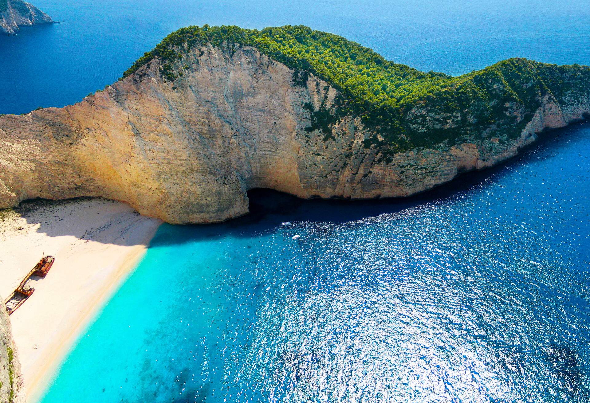 Also known as the Smugglers Cove and Navagio beach. This is one of the most photographed beaches in Europe..There's a small bridge that is built out over the Cliff to get this view.