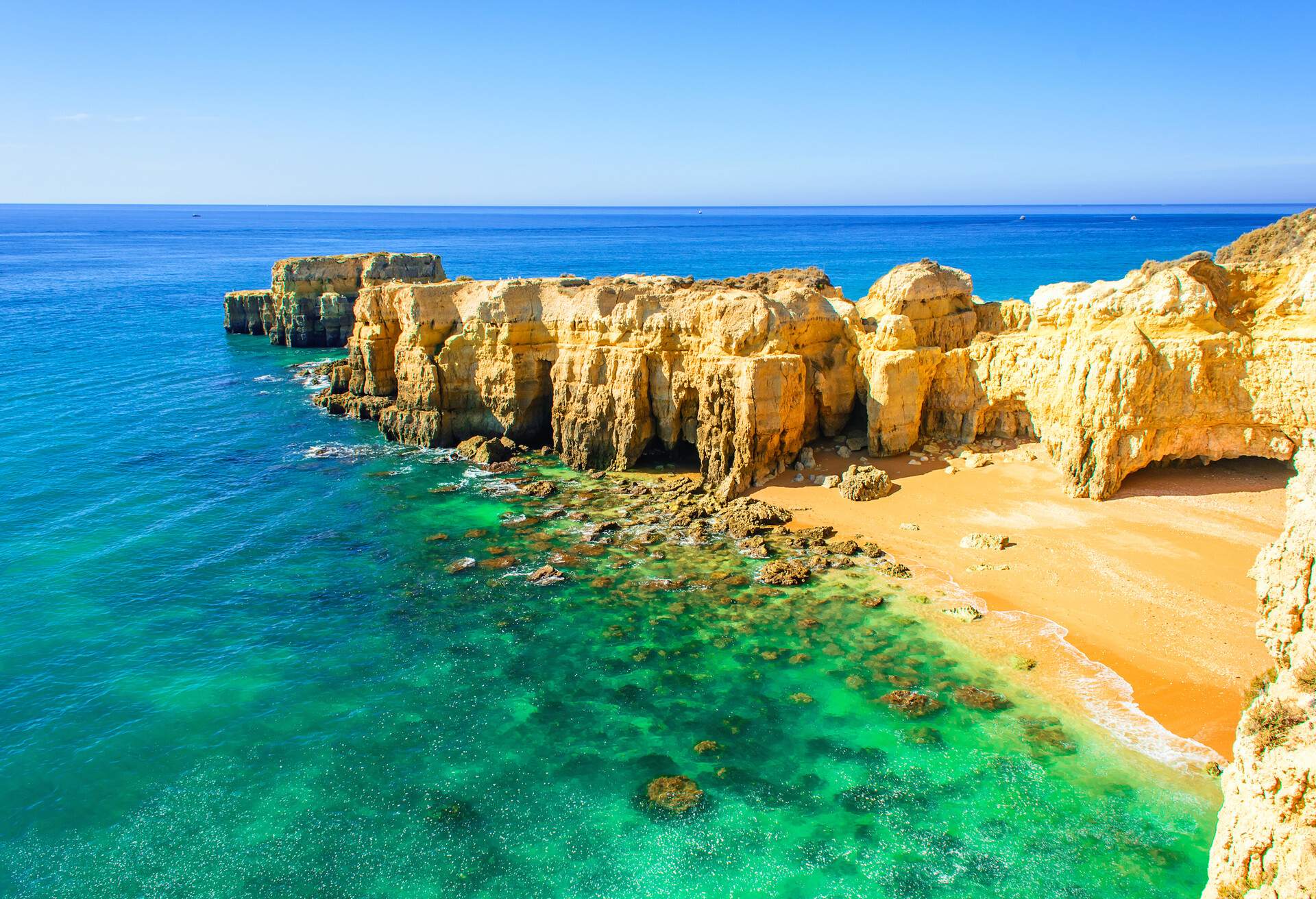beautiful sea view with secret sandy beach among rocks and cliffs near Albufeira in Algarve, Portugal; Shutterstock ID 608838695