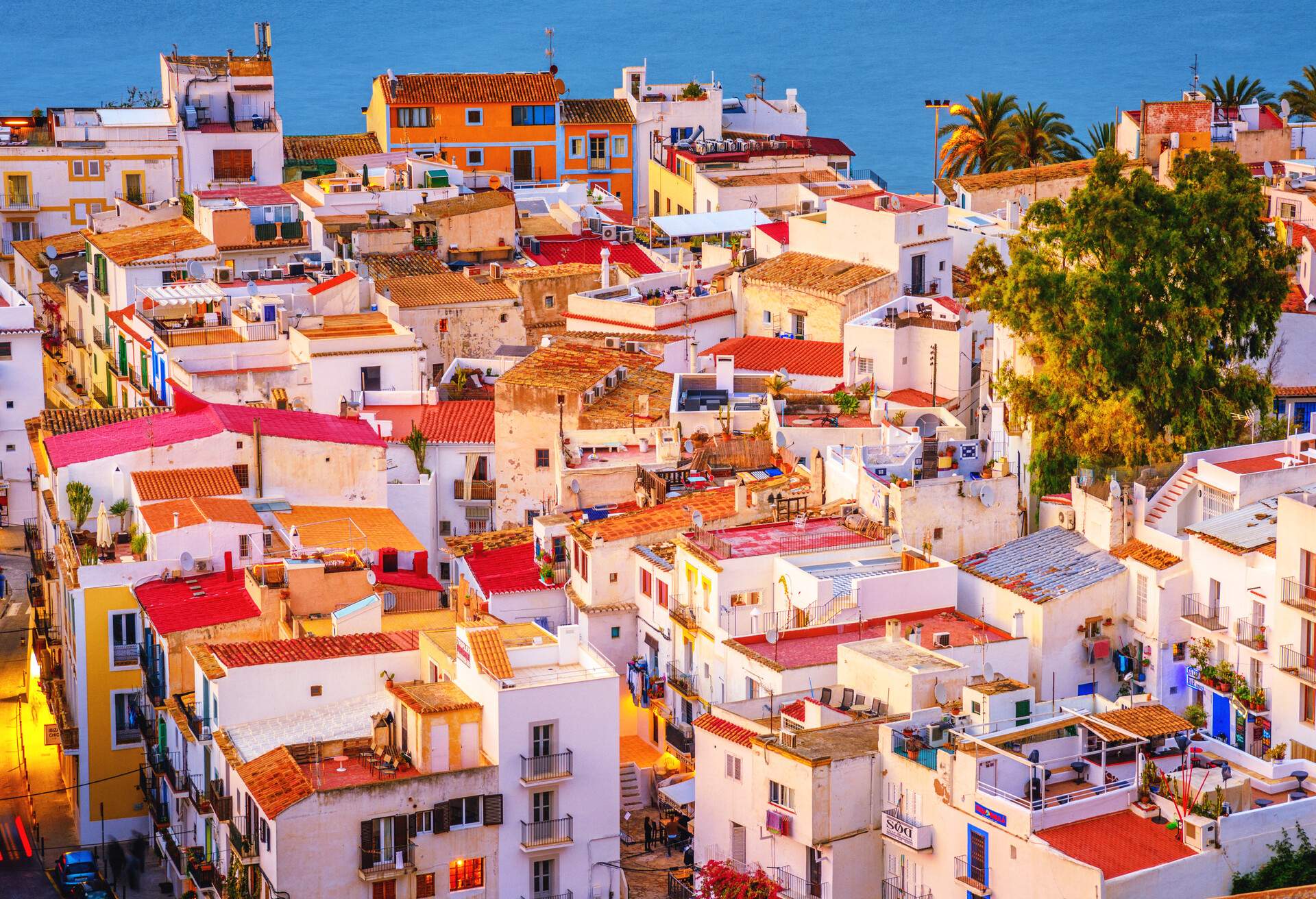 Elevated view on colorful Ibiza Down Town at dusk.