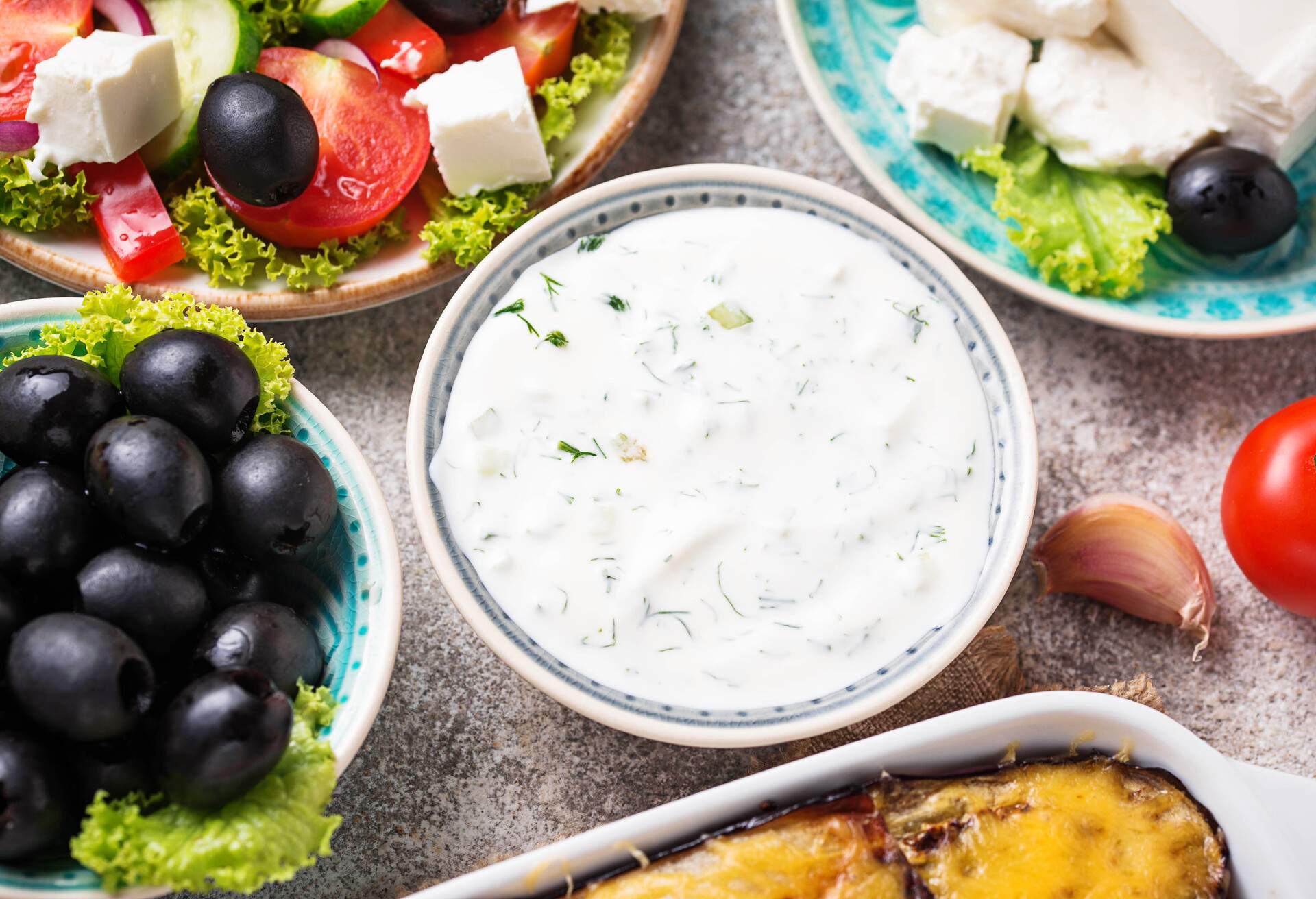Tzatziki sauce and traditional greek dishes. Top view