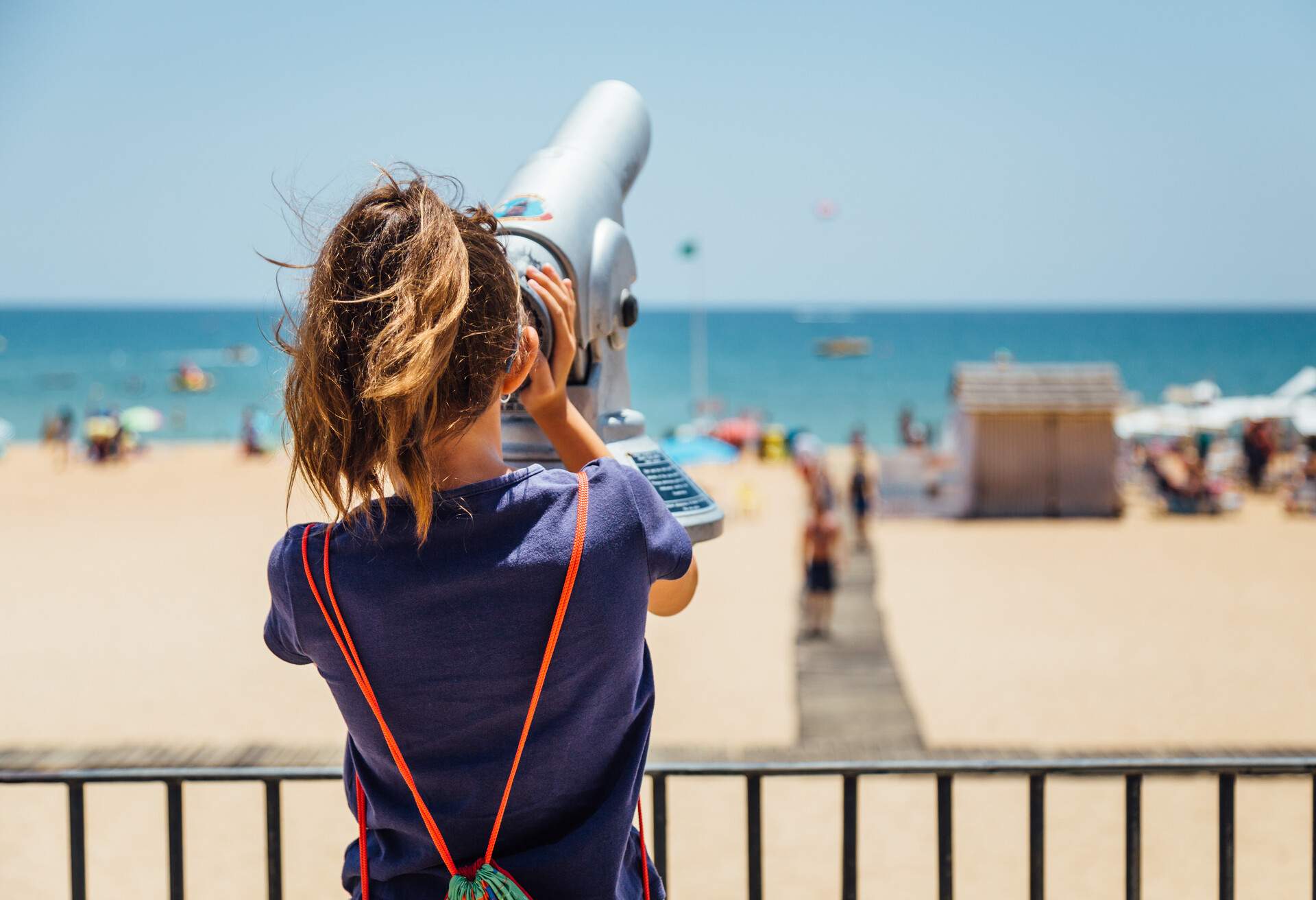 DEST_PORTUGAL_ALBUFEIRA_WOMAN_BEACH_GettyImages-1061289106_Universal