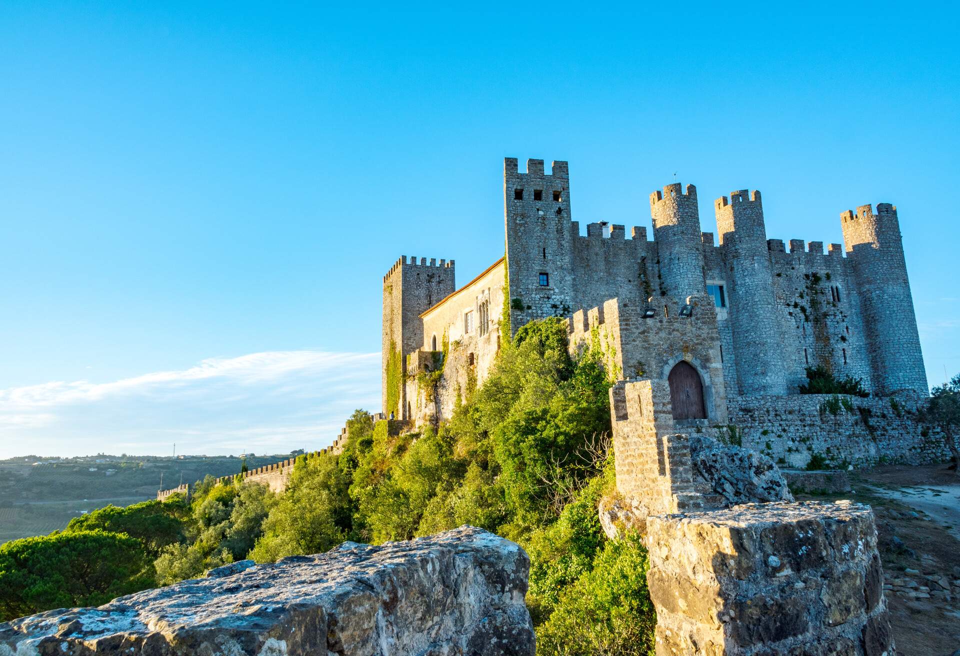 OBIDOS, PORTUGAL. The Castle of Obidos (Castelo de Obidos) is a well preserved medieval palace in the town of Obidos in Western Portugal at morning.; Shutterstock ID 1048249861