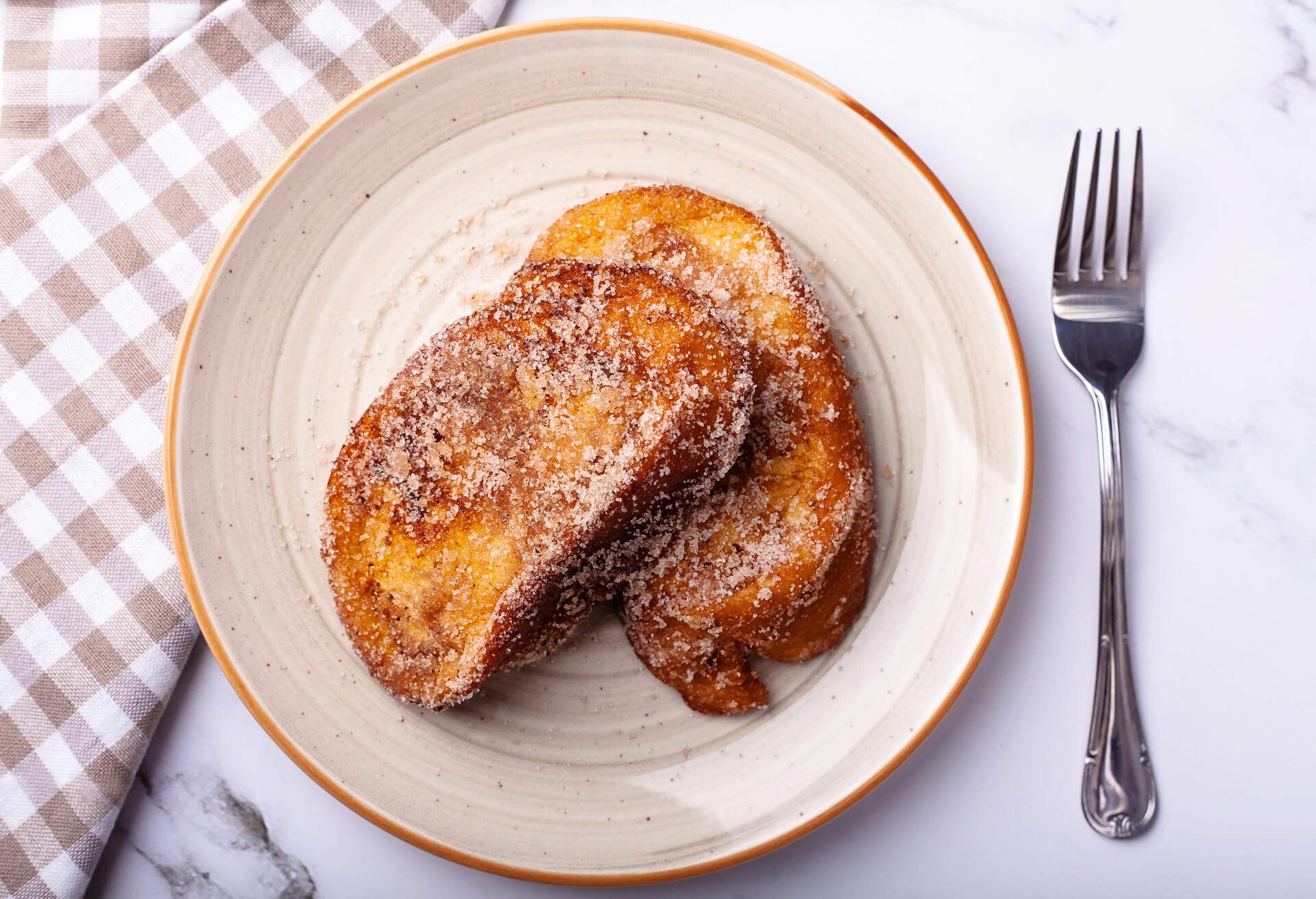 Flat lay of easter torrijas on marble surface