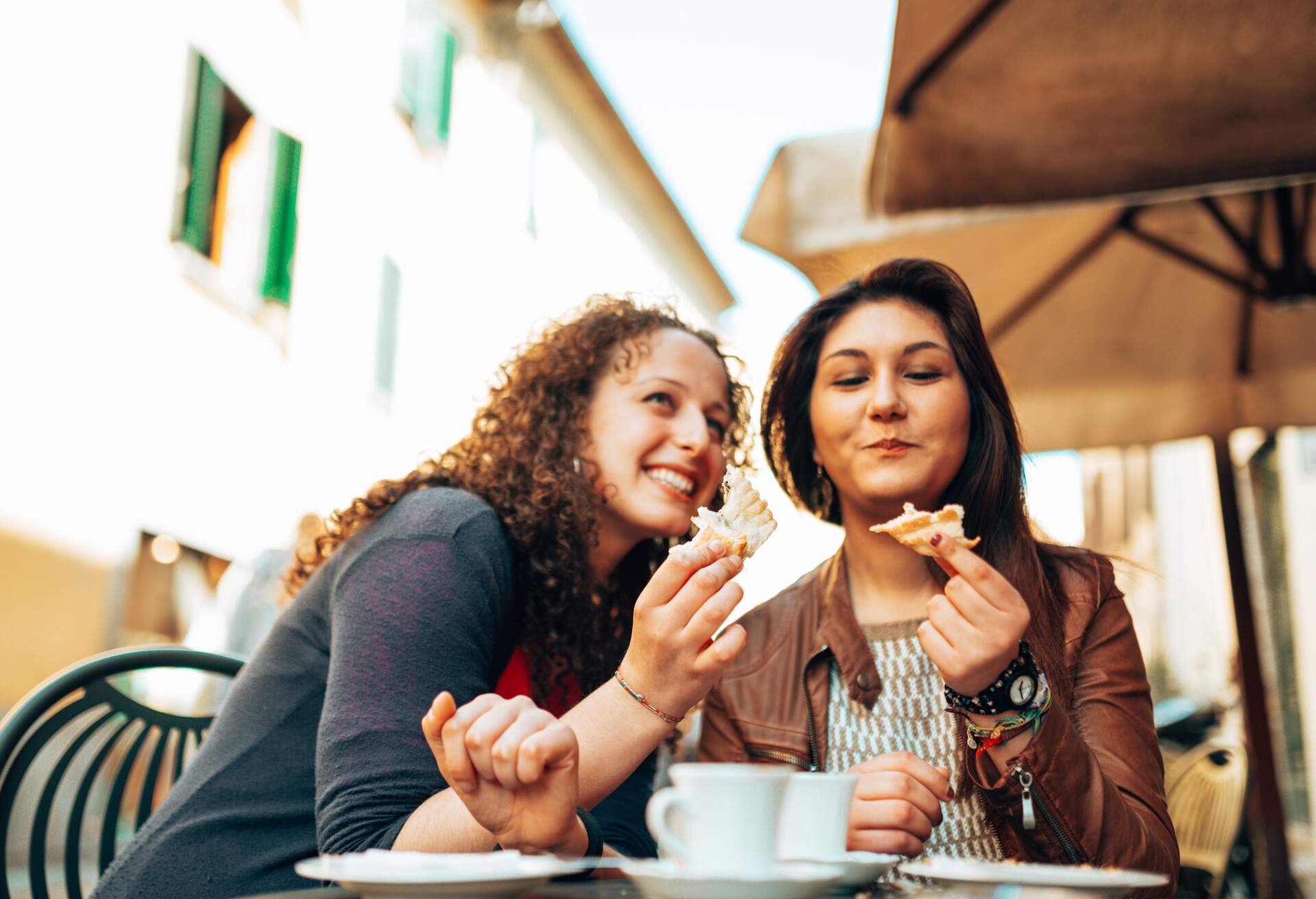 happiness couple of friends taking a coffee