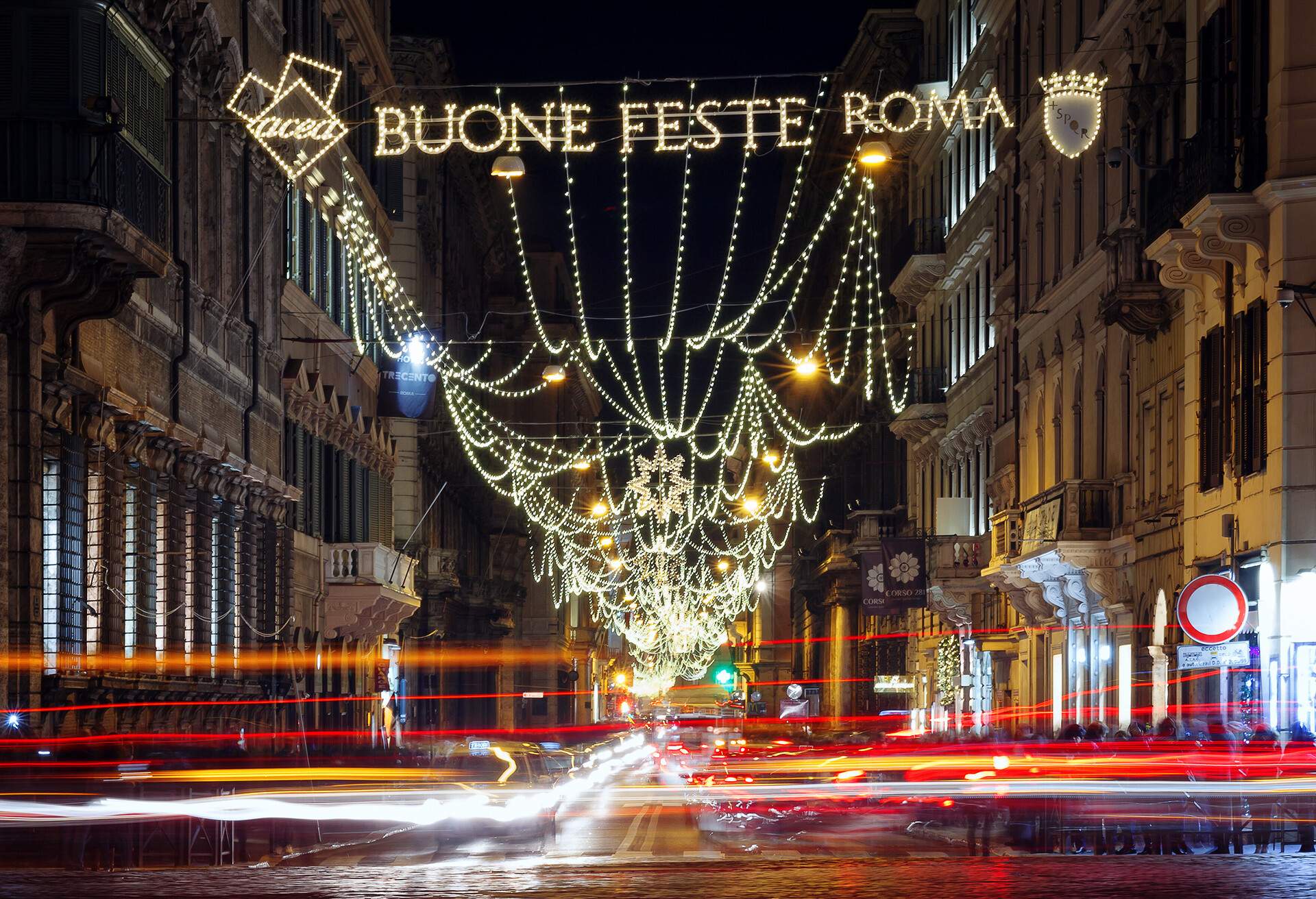 Rome, Via del Corso lit with LED lights and a text wishing you a Merry Christmas