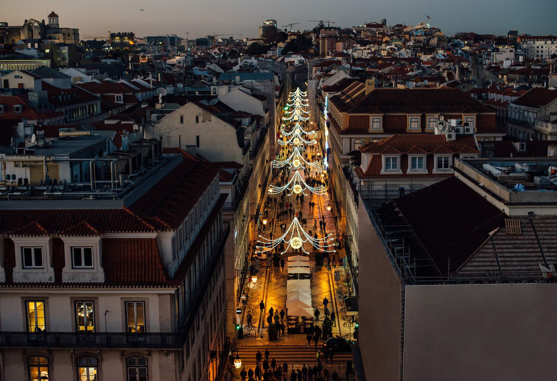 Rua Augusta street in Lisbon illuminated with decoration with words in French and Spanish 
