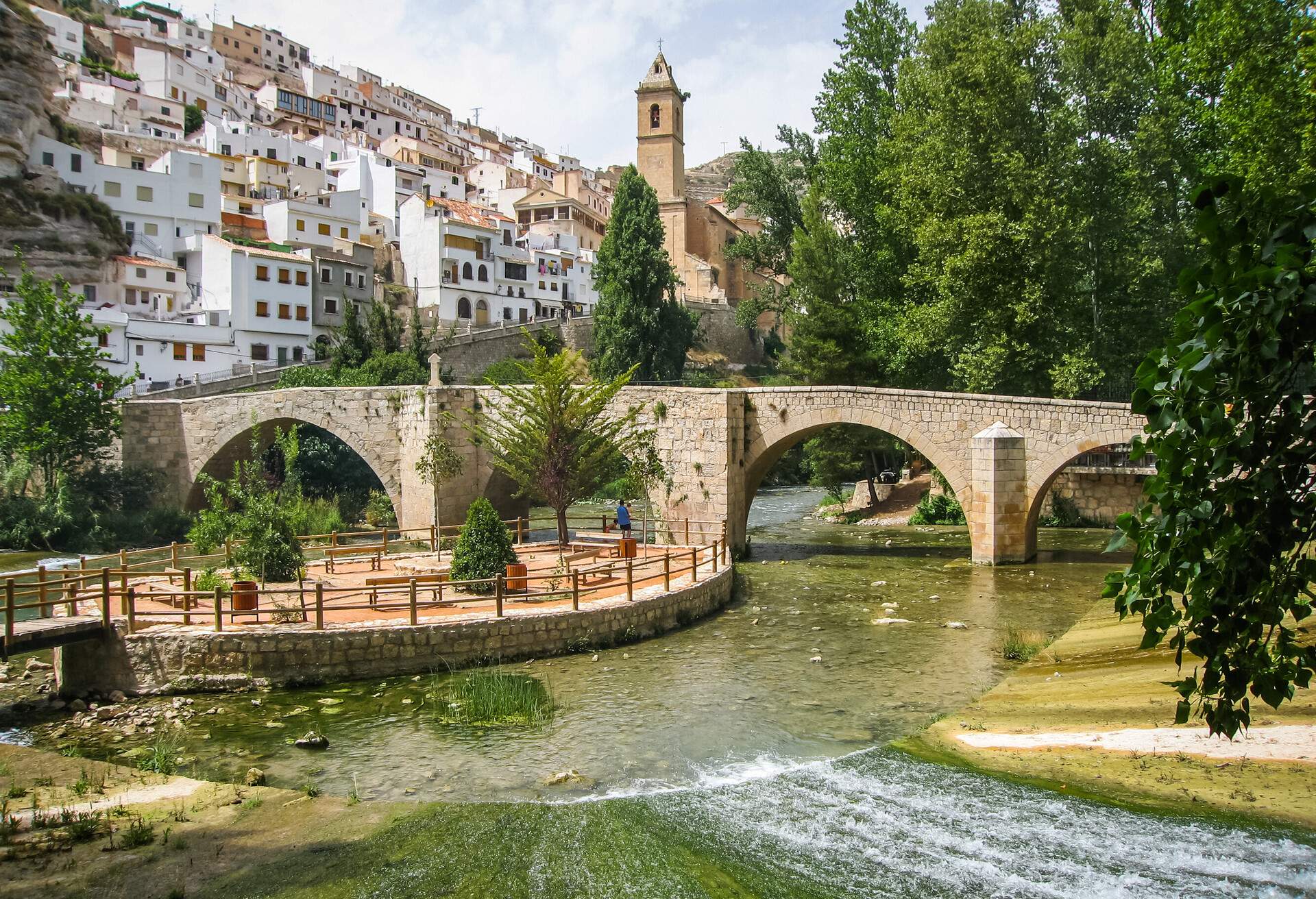 Cityscape with bridge over river at Alcala del Jucar in Castilla la Mancha, Spain