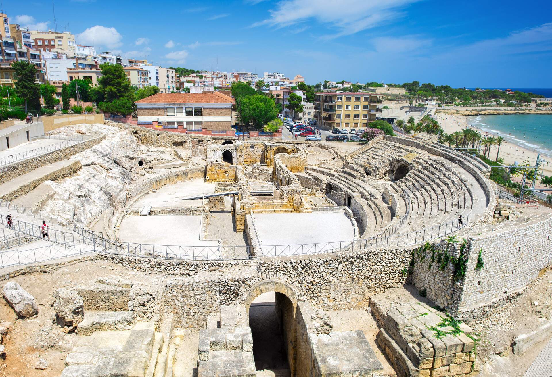 View to the historic site of an ancient Roman amphitheater near the Mediterranean coast in Tarragona, Spain; Shutterstock ID 700068754; Purpose: CITY; Brand (KAYAK, Momondo, Any): KAYAK