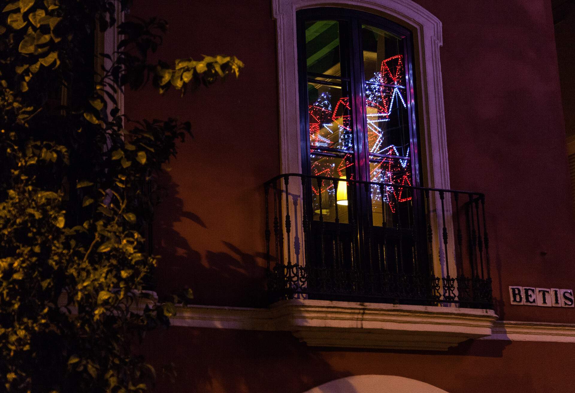 reflection of christmas light in calle Betis, one of the cool way of Sevilla