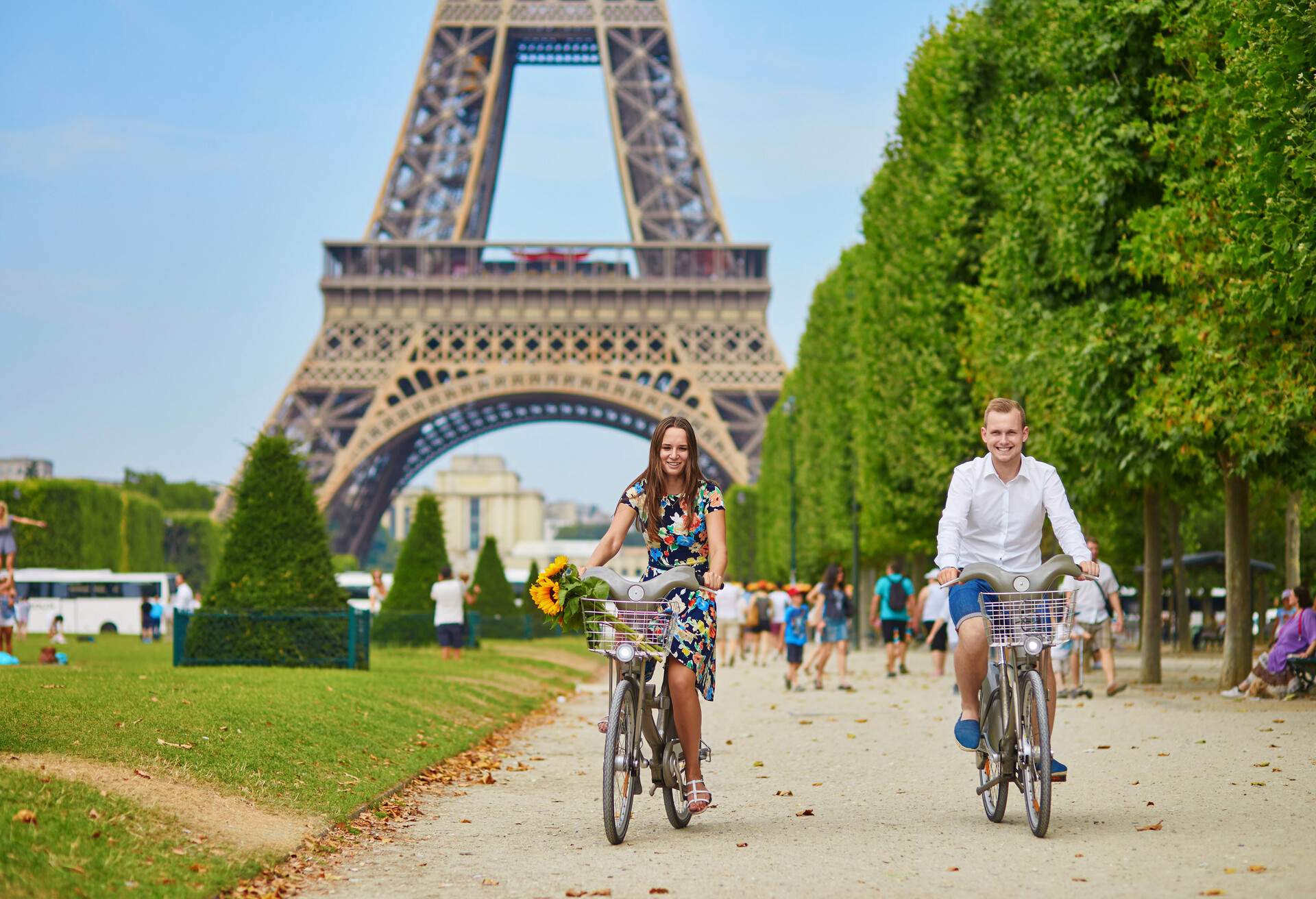 Romantic couple riding bicycles near the Eiffel tower in Paris; Shutterstock ID 367875839; Purpose: Content; Brand (KAYAK, Momondo, Any): Momondo