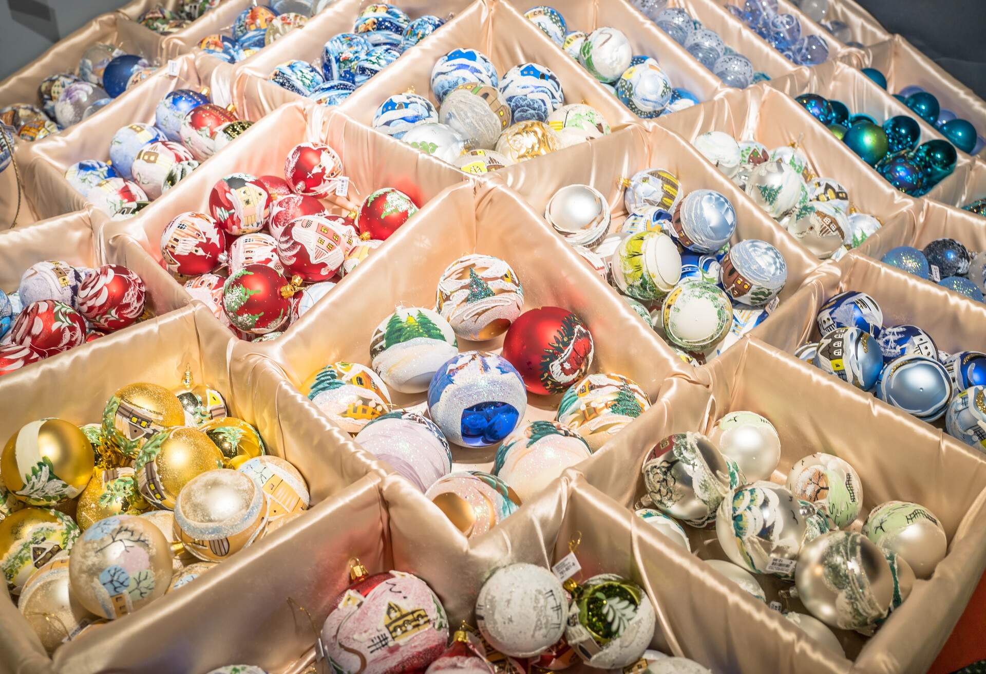 Close up view of shiny colourful christmas balls for sale