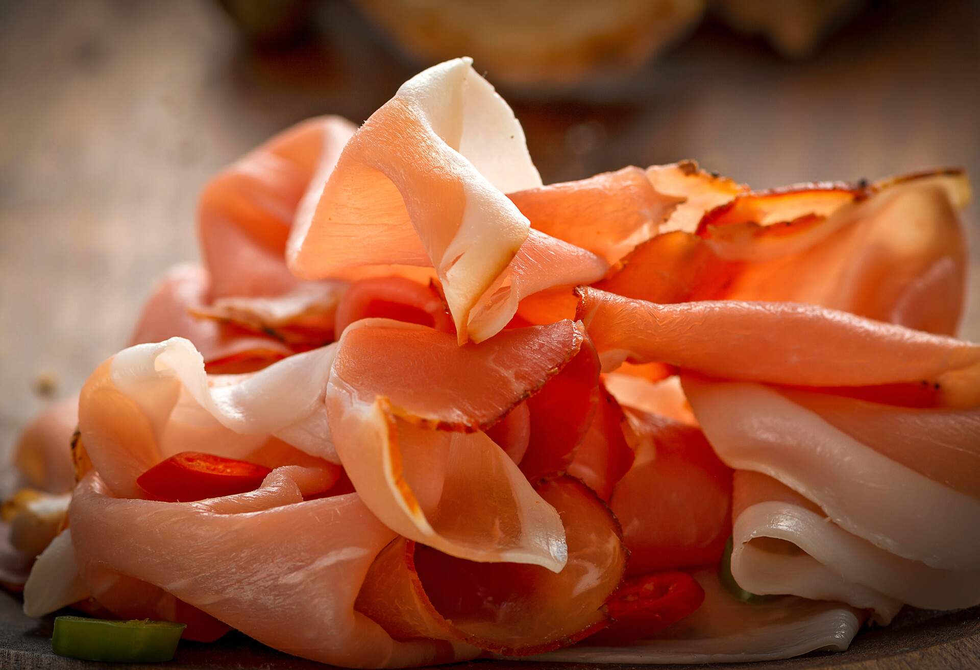 Sliced ham on wooden cutboard