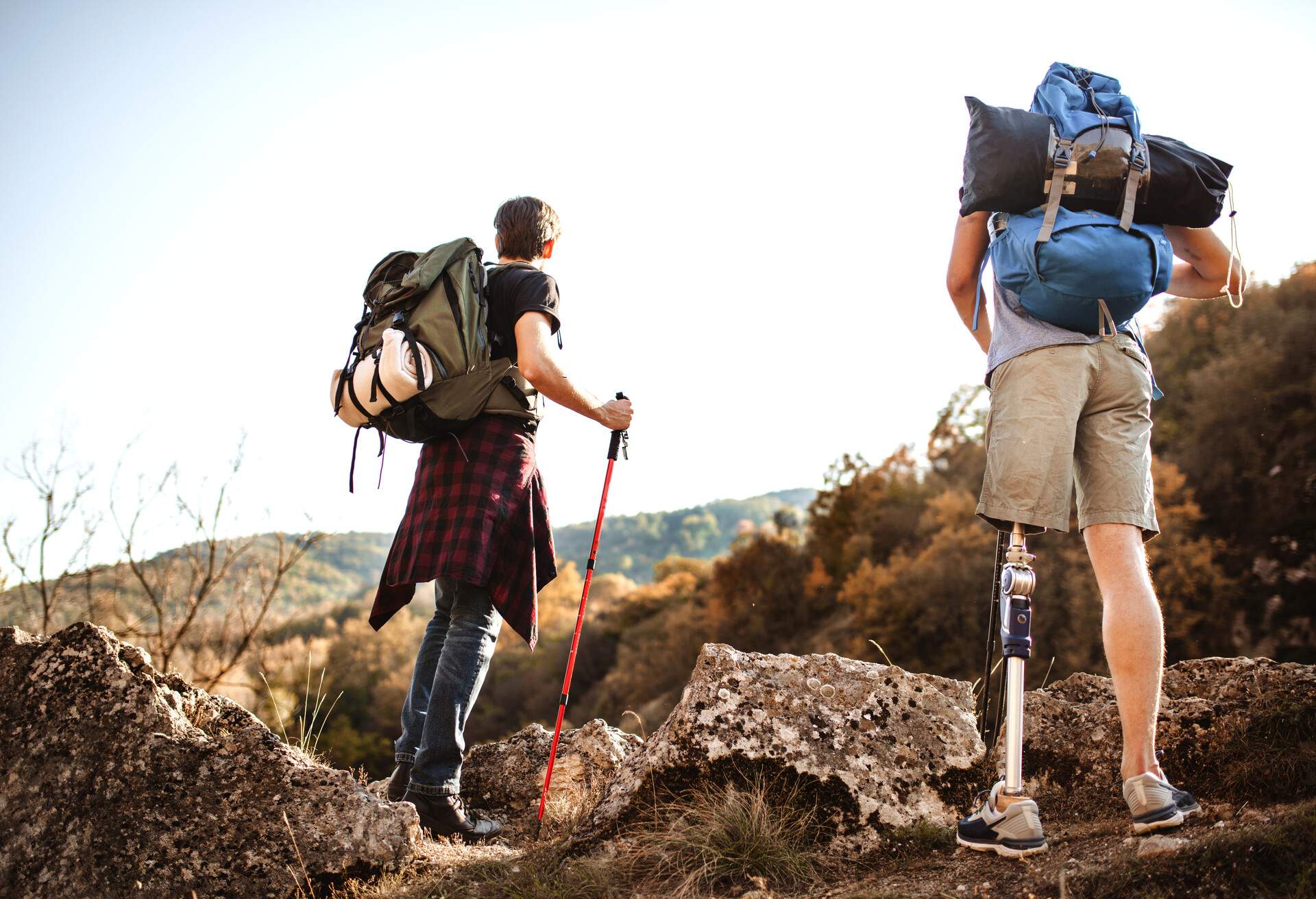 Disabled young man on a hike with his male friend