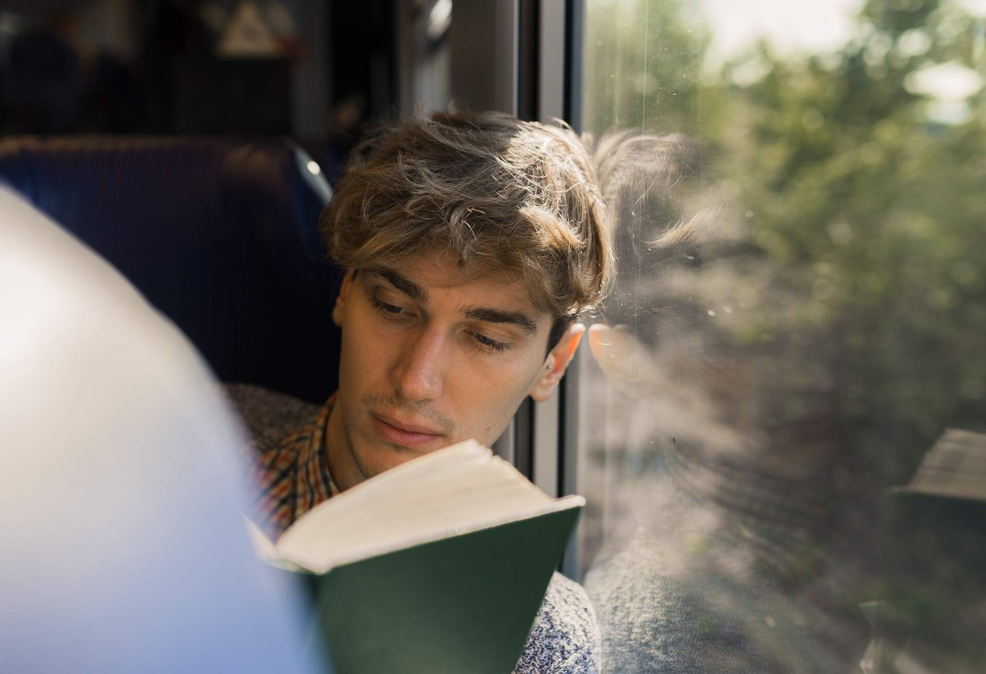 theme_train_man_reading_gettyimages