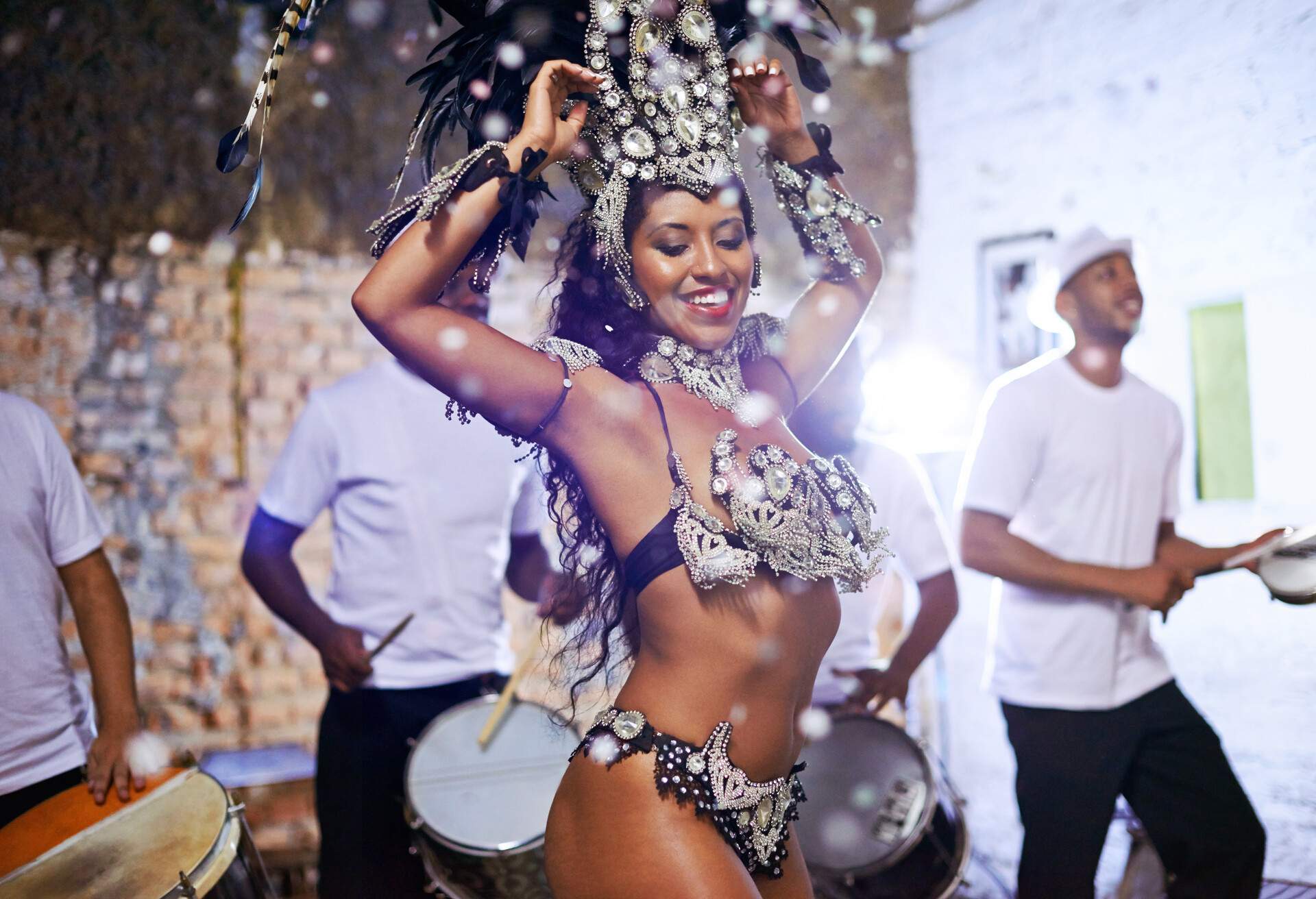 Shot of an attractive female Mardi Gras dancer in an elaborate beaded costume and feather headdress