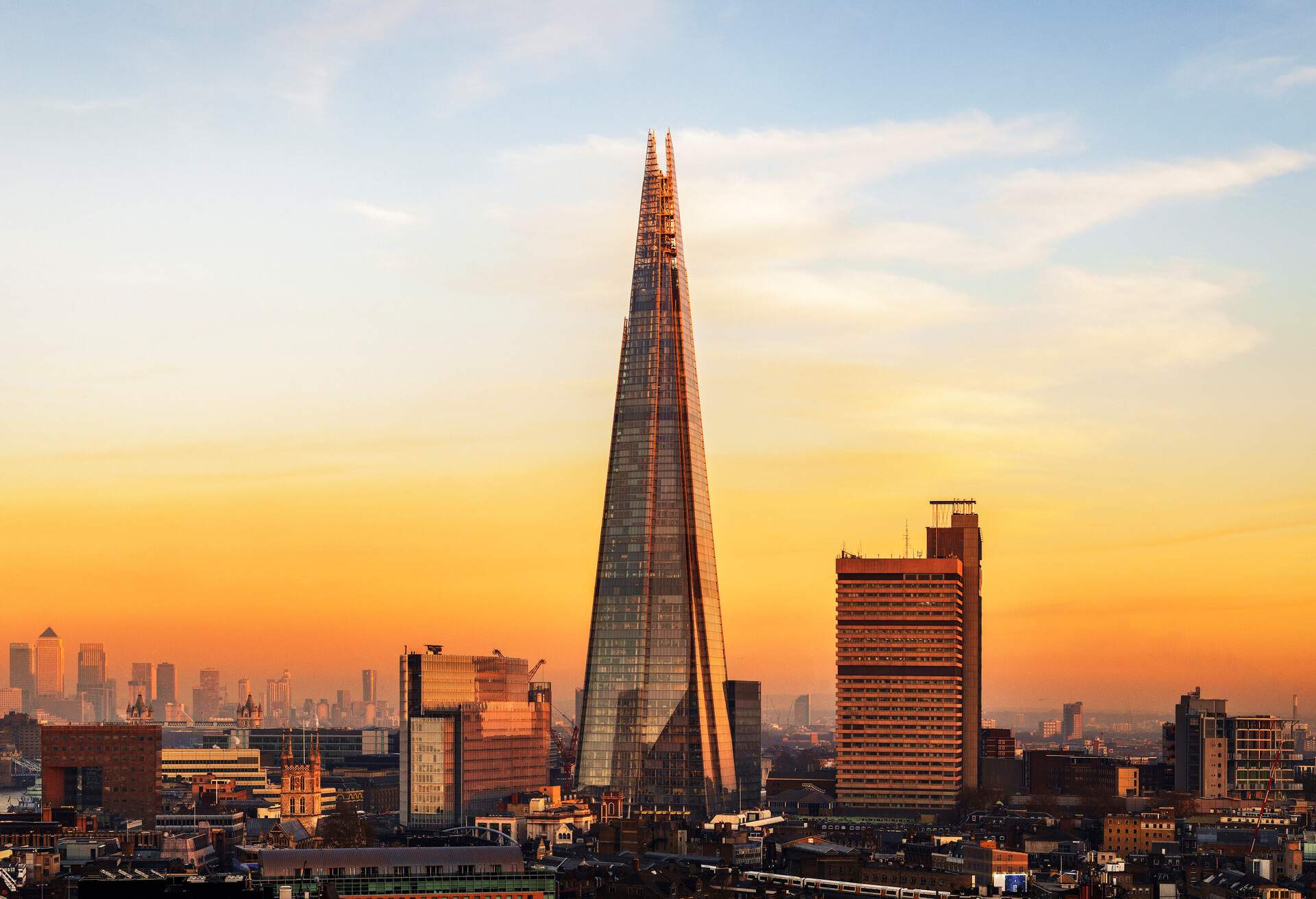 UK, London, looking towards the Shard and East London from high up, with view of Canary Wharf in the distant