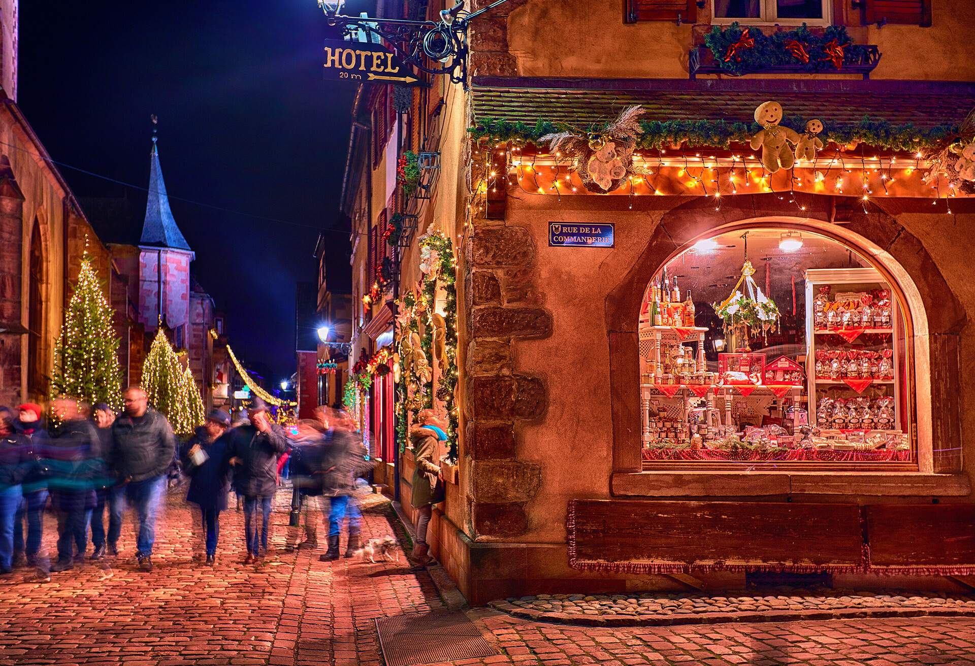 crowded beautiful Rue De La Commanderie street of Kaysersberg village on Christmas holidays. Alsace, France