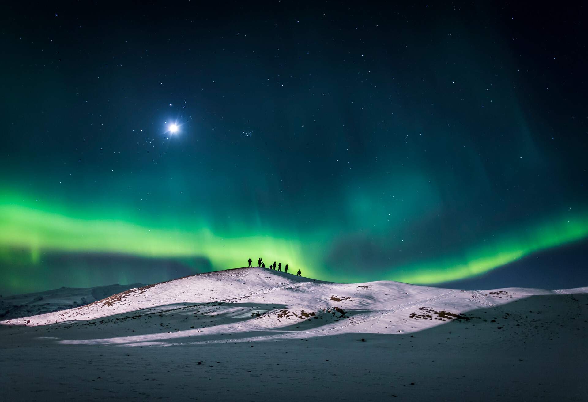People with Auroras and  moon light at the Jokulsarlon, Breidamerkurjokull Glacier, Vatnajokull Ice Cap, Iceland