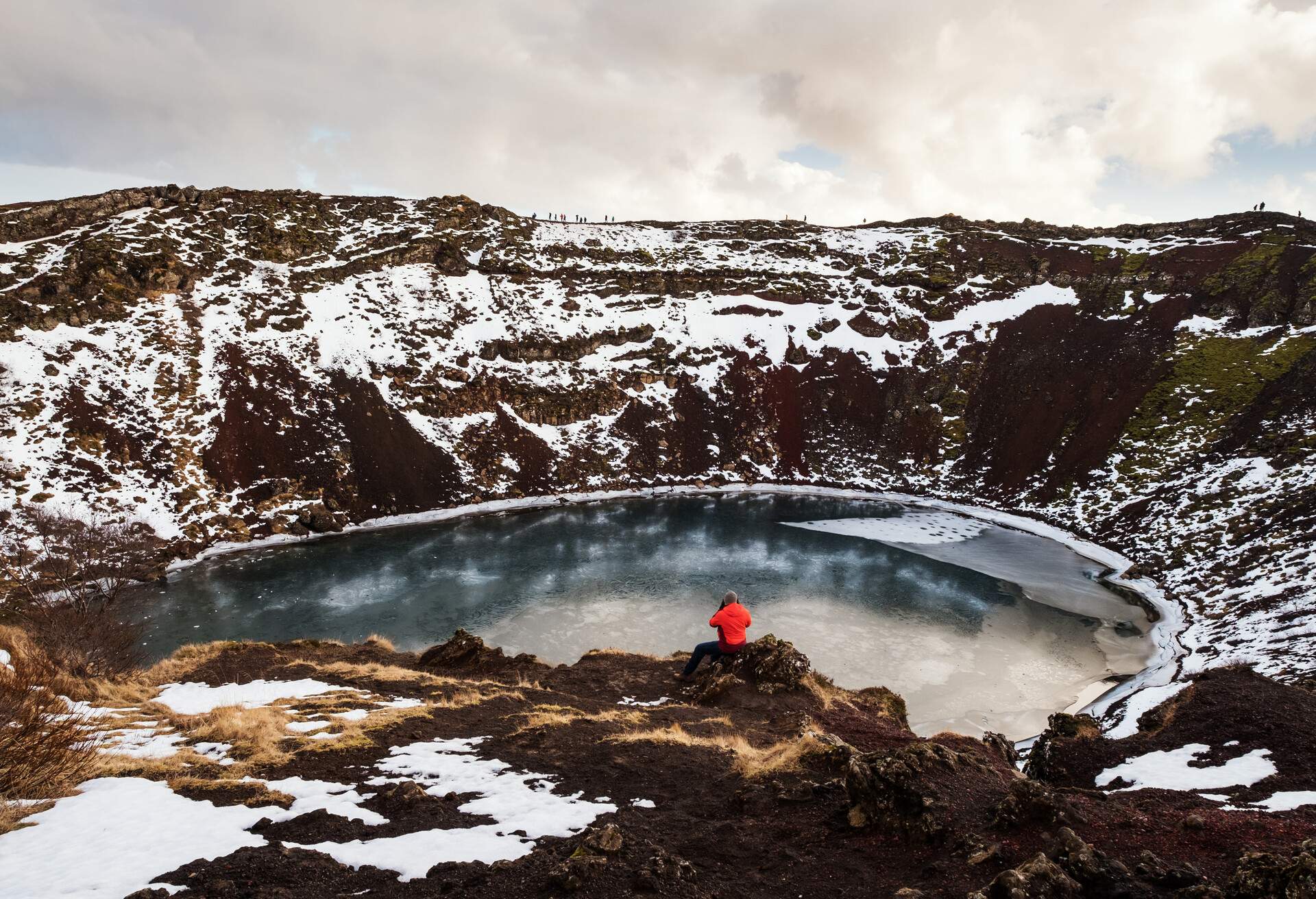 Traveler enjoying beautiful view at Kerio Crater with Lake in Iceland