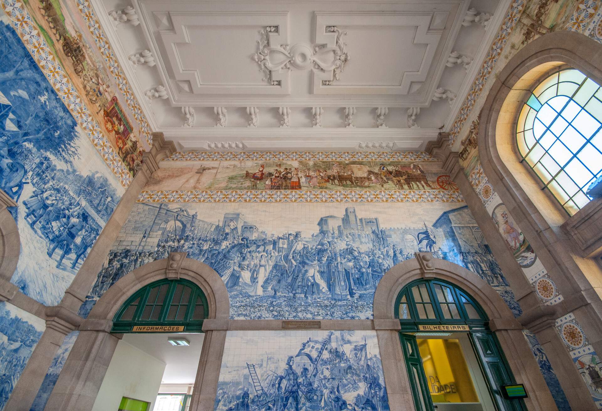 Azulejo tiles in the vestibule of the train station depicting the conquest of Cueta, Porto, Portugal, Europe.