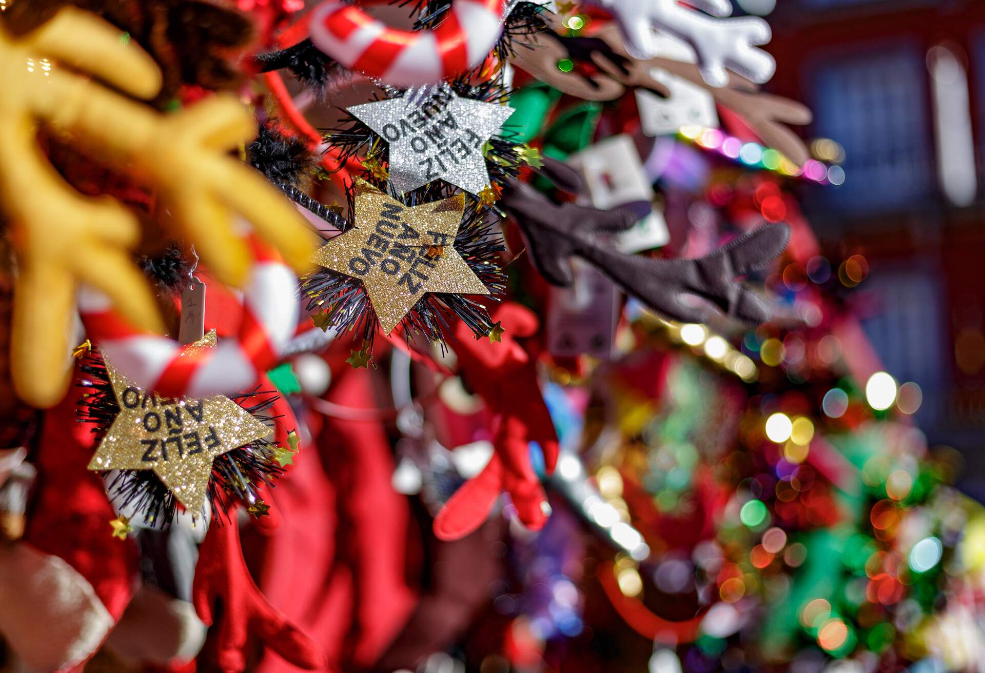 Madrid, Spain. December 3, 2022. Christmas ornaments and motifs on display for sale in plaza mayor of Madrid. Happy New Year stars