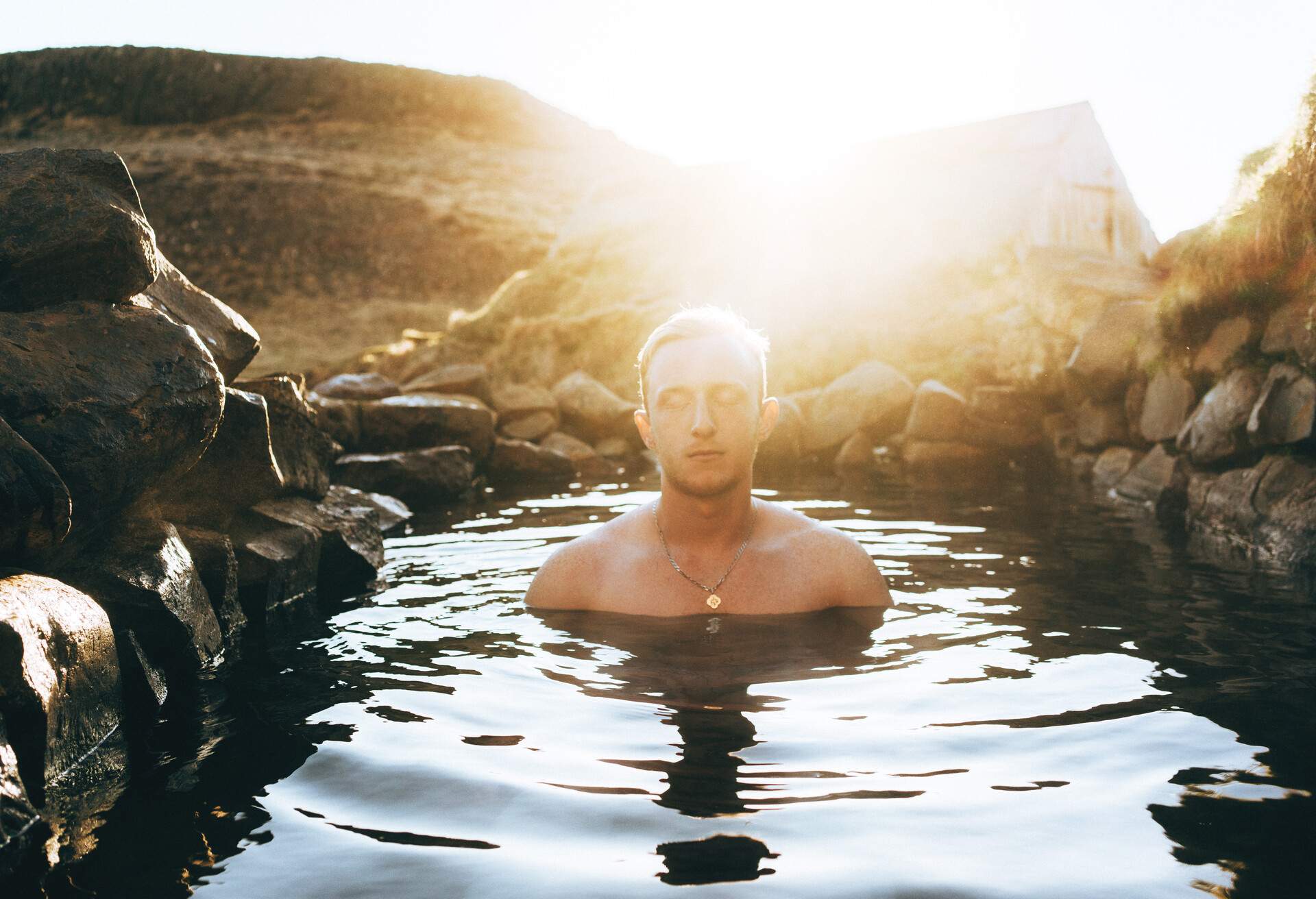 Man swimming in the hot spring in Iceland
