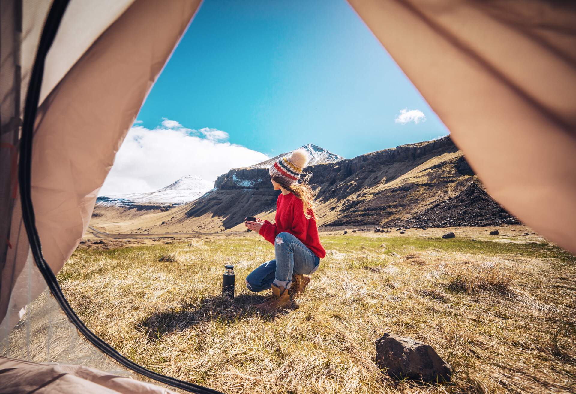 Young woman enjoying camping in Snaefellsness peninsula, Iceland