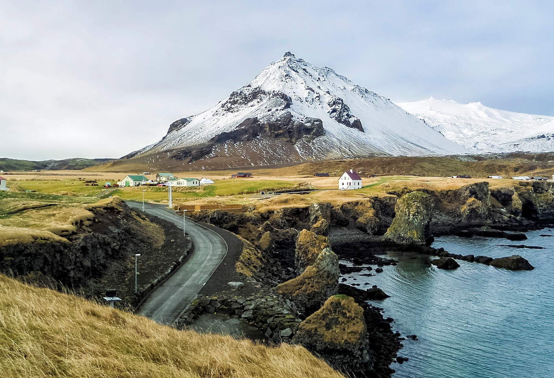 Snæfellsnes Peninsula Fishing Village and mountains with snow at western Iceland 