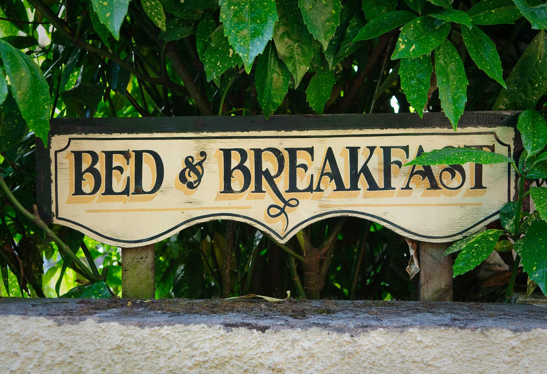 Bed and breakfast vintage sign on fence. Devon, UK.