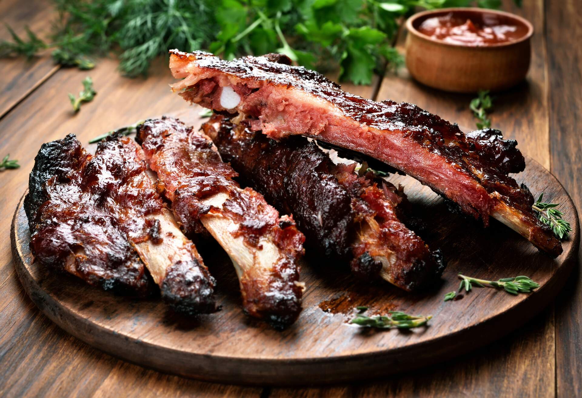 Roasted sliced barbecue pork ribs, focus on sliced meat