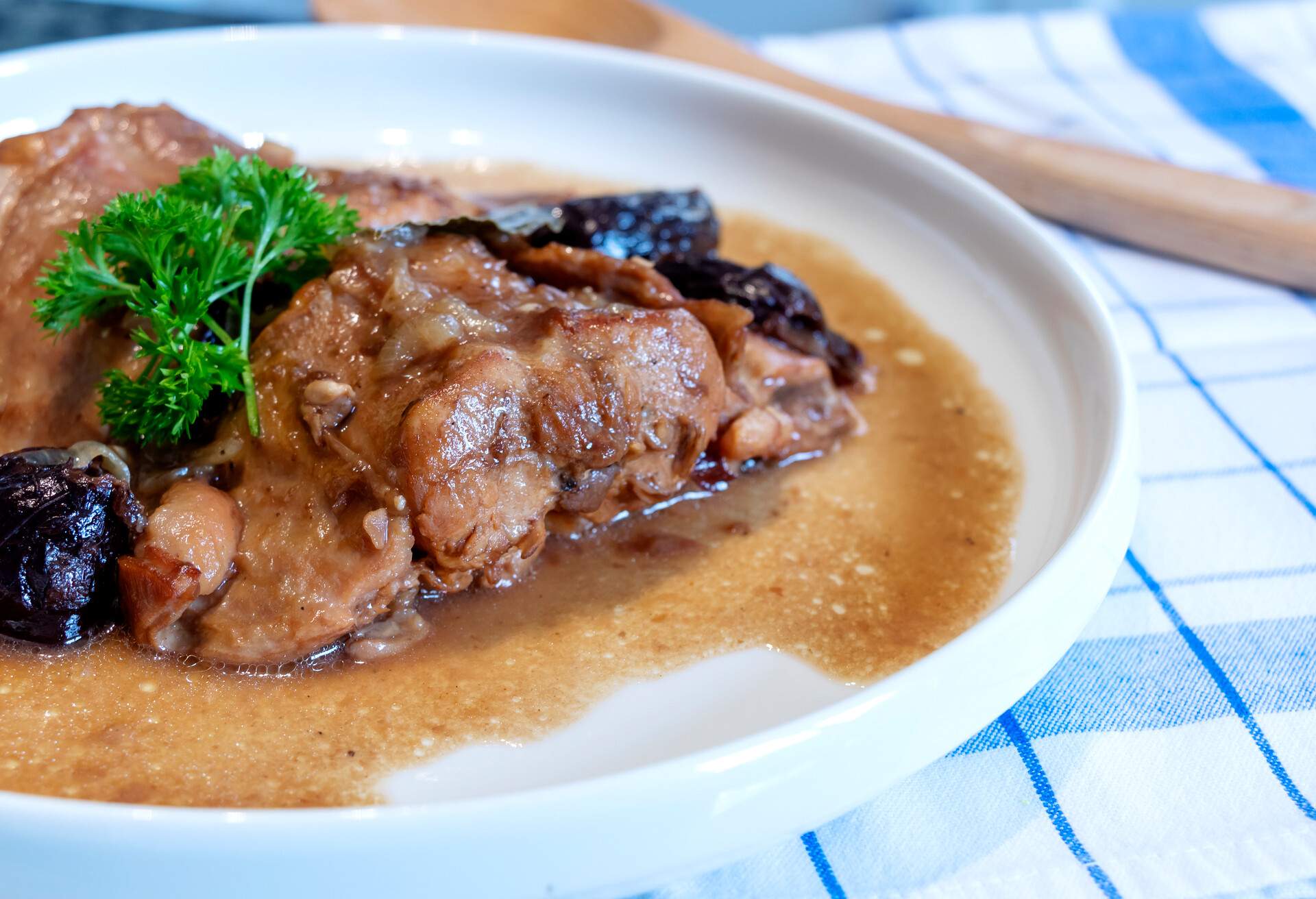 Background of Rabbit dish with brown sauce, and prunes sauce very famous in Europe. European people like to eat in winter season.