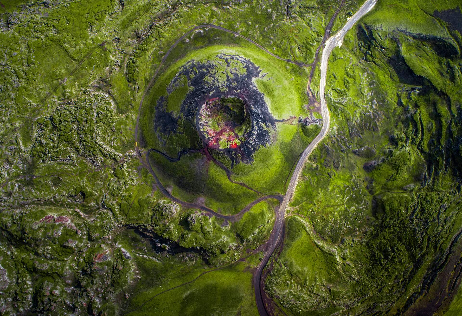 Fjallabak is Nature Reserve area in the highlands of Iceland. It has volcanic activity and the vivid colors are due to the rhyolite and obsidian making the ground appear blue, green, red, pink and yellow.