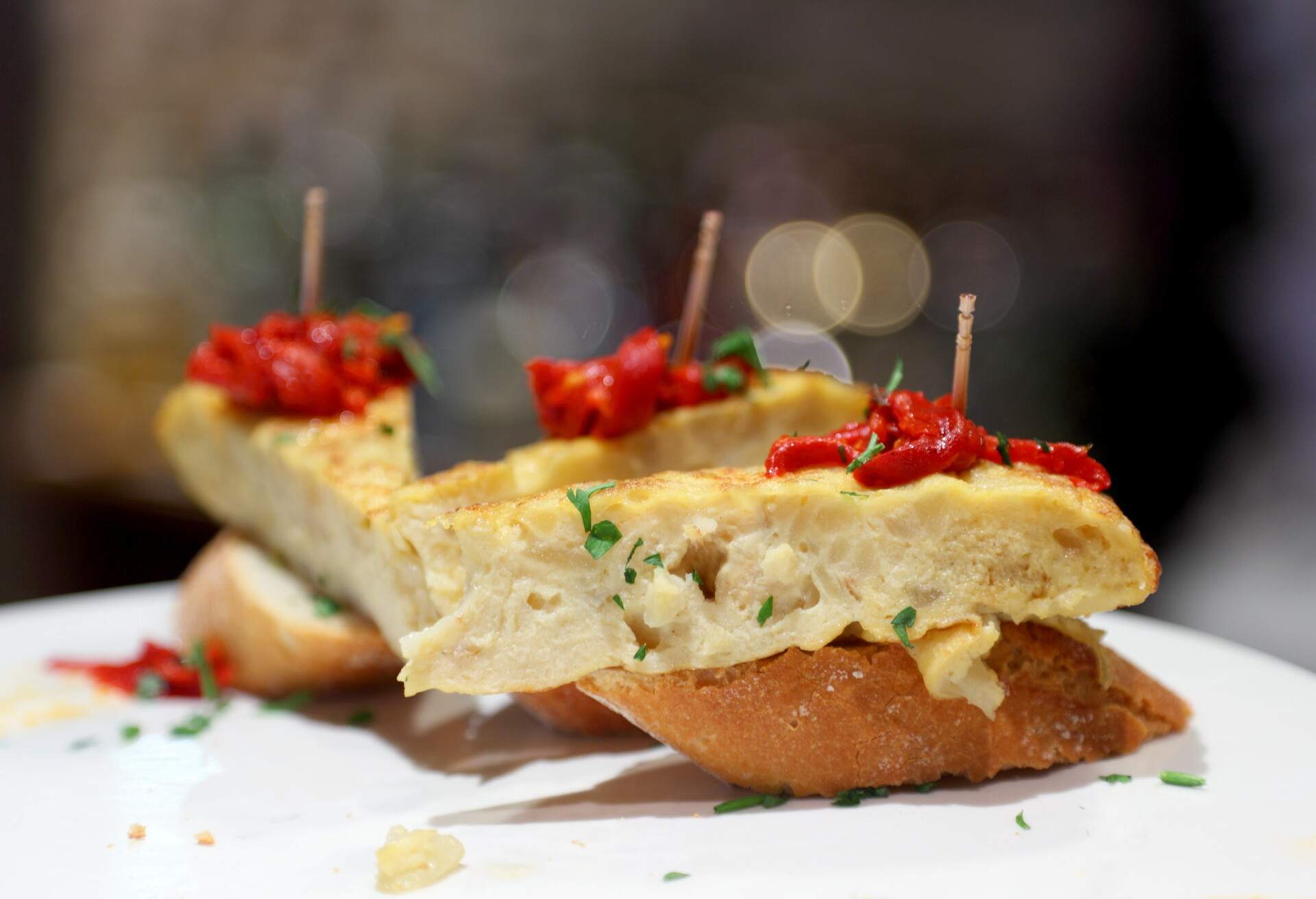 Pincho or pintxo name of certain snacks typically eaten in bars, traditional in northern Spain and especially popular in Basque country.