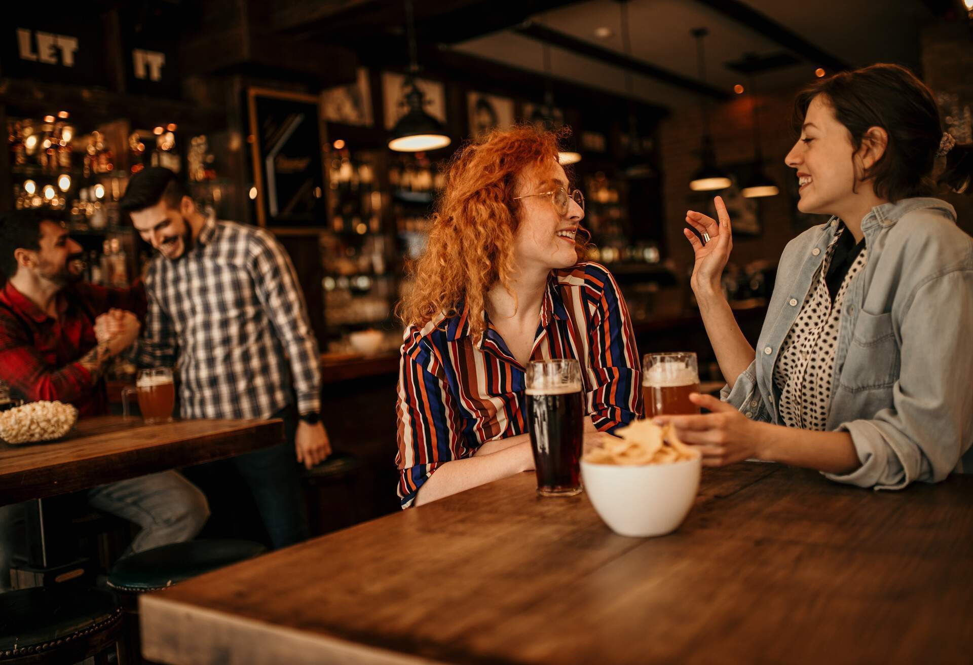 THEME_BAR_PUB_LGBTQ_COUPLE_GettyImages-1411942158