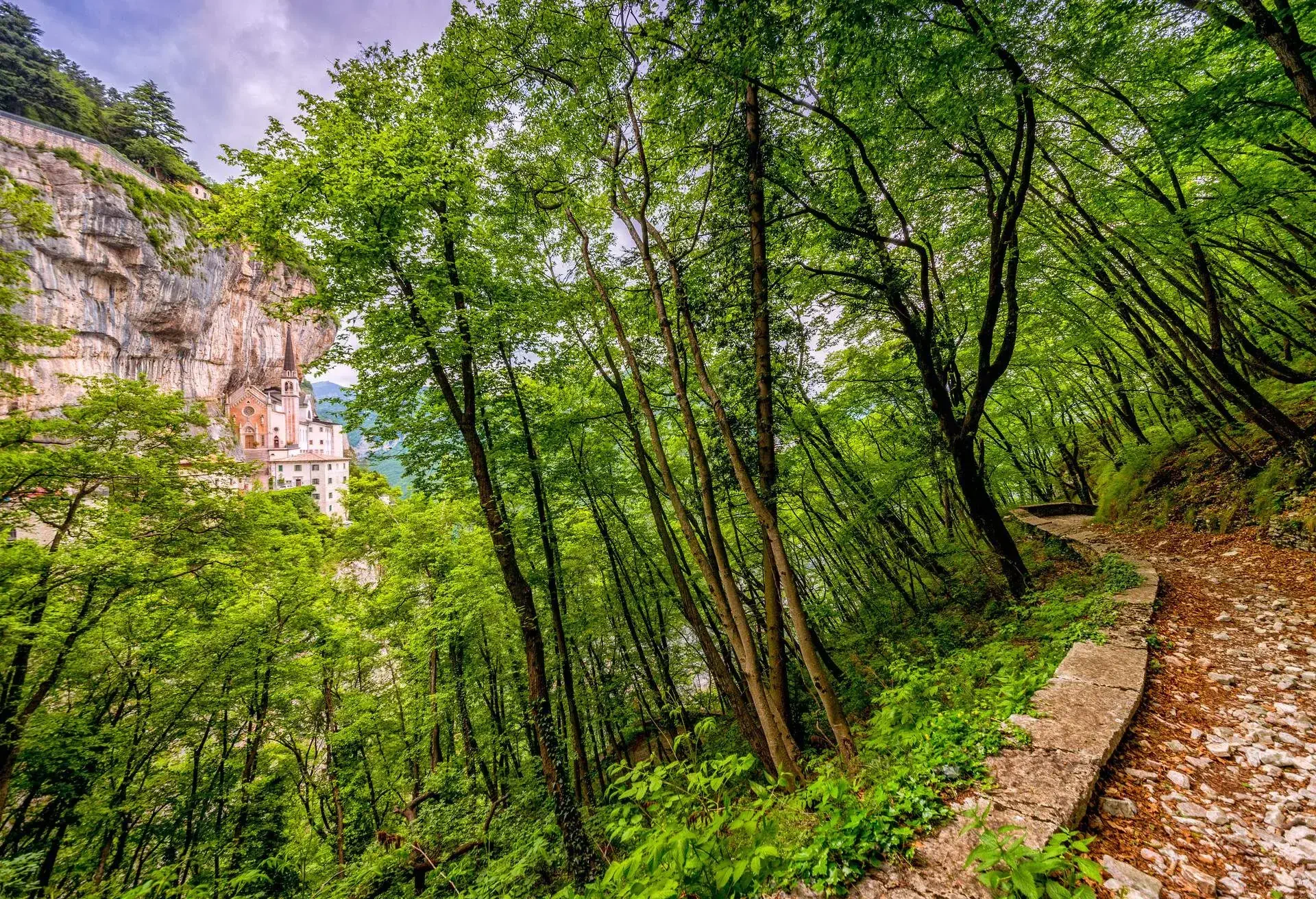 Hiking path near the Sanctuary of Madonna della Corona a pilgrimage place near the town of Spiazzi in Veneto, Italy. Located at 773 meter it is one of the highest pilgrimage places in Italy, high above the valley hidden in the rocks of the Monte Baldo massif east of Lake Garda.