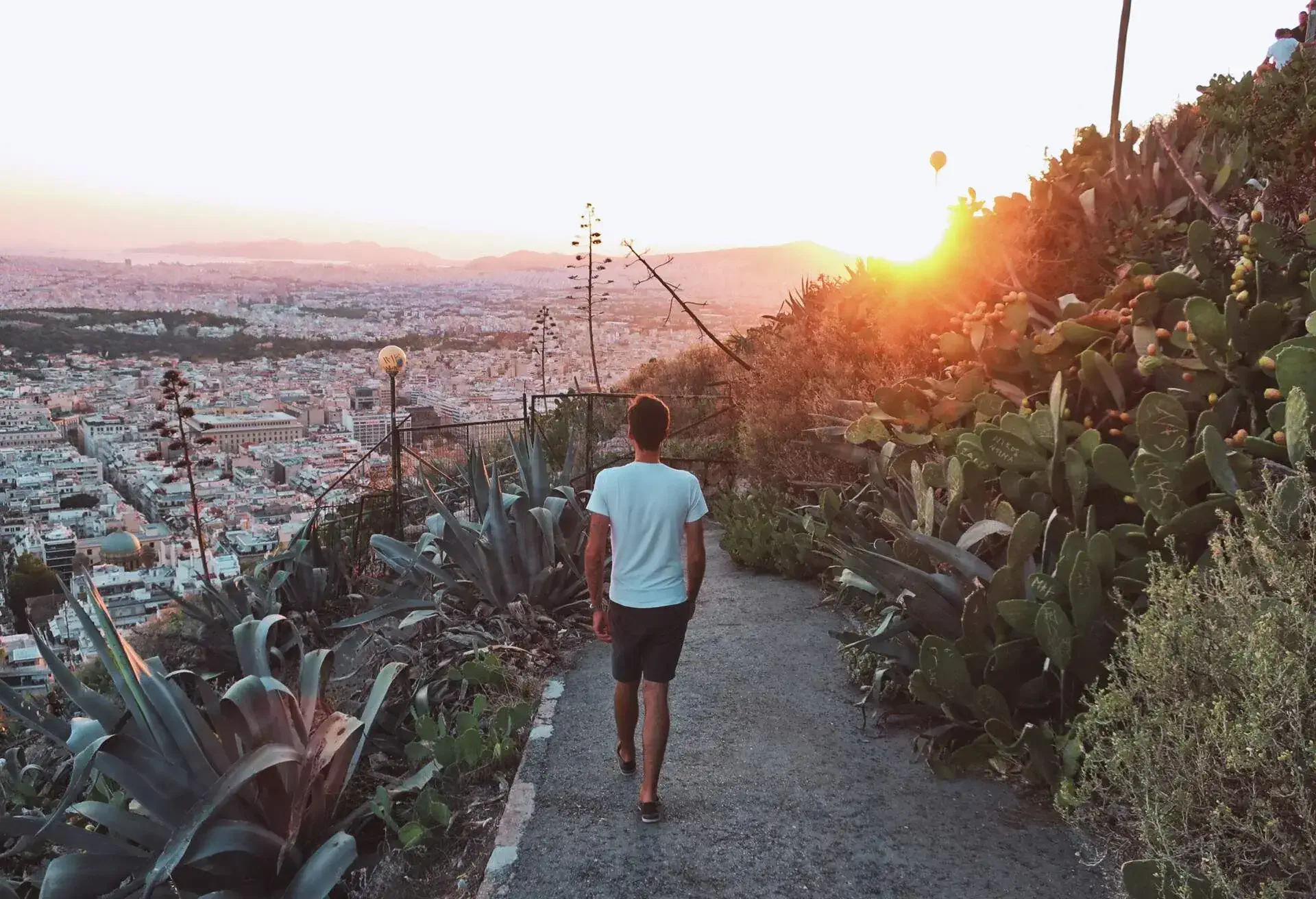 DEST_GREECE_ATHENS_LYCABETTUS_SUNSET_PEOPLE_MAN_GettyImages-1246924174.jpg