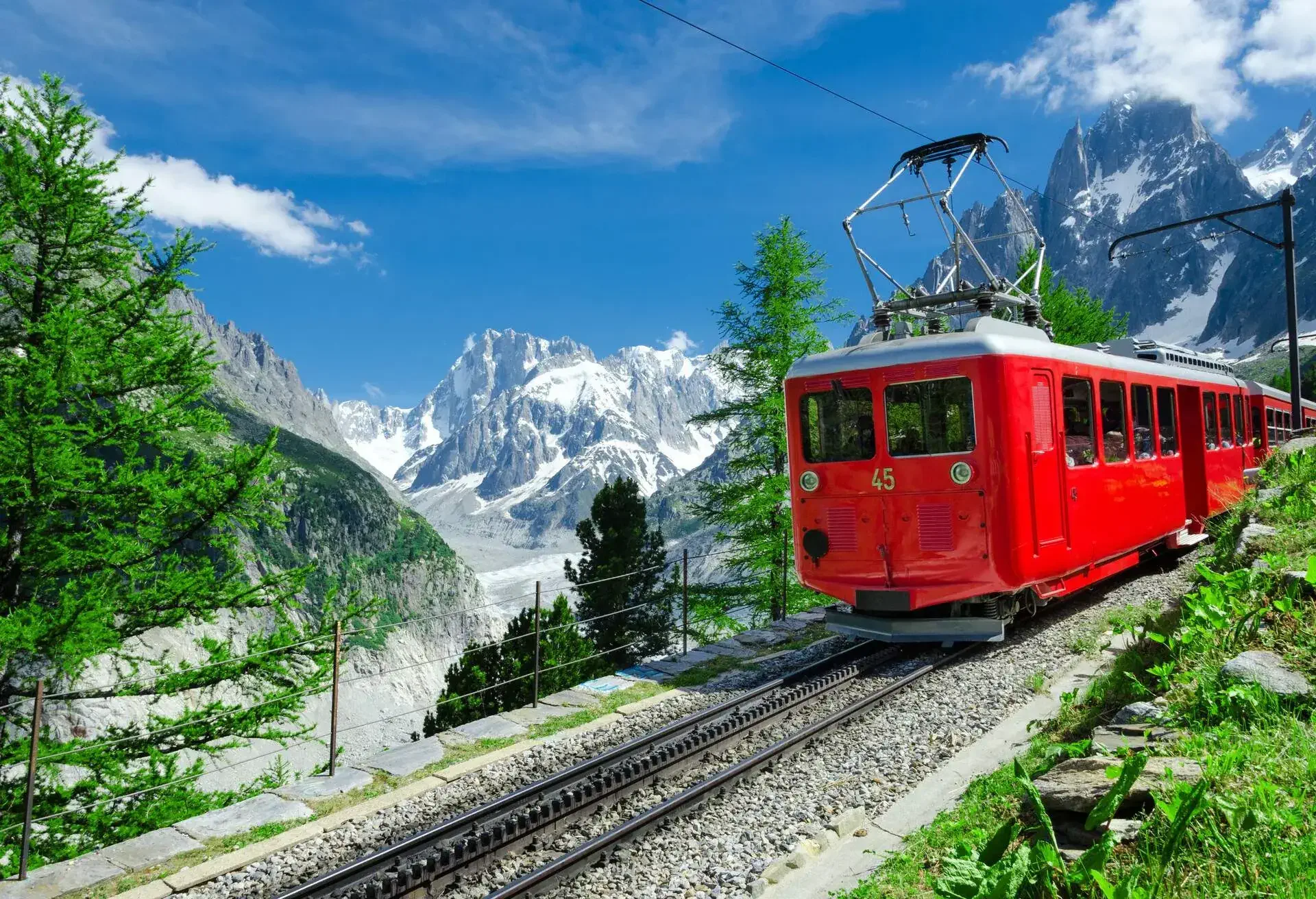 The alpine mountain background landscape photo was taken outdoors on a sunny day in summer with blue sky and copy space.