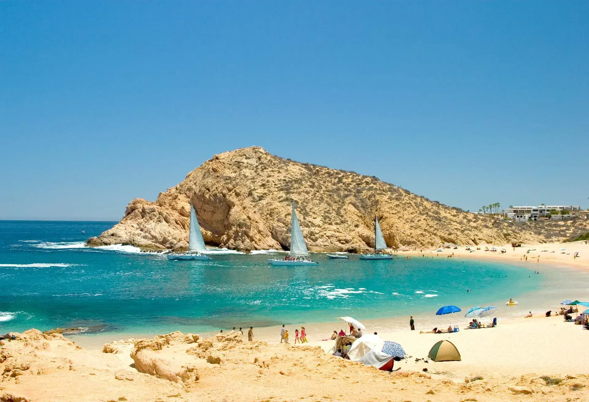 DEST_MEXICO_CABO_SAN_LUCAS-Tropical Beach with Sailboats-GettyImages-90399257
