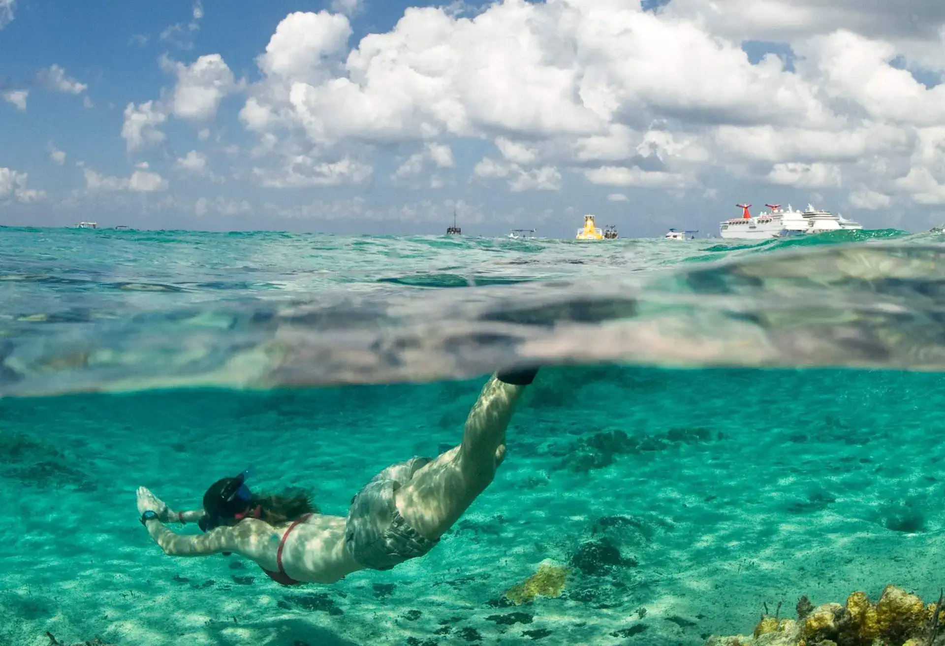 DEST_MEXICO_QUINTANA-ROO_COZUMEL_WOMOAN_SNORKELING_OCEAN_CORAL-REEFS_GettyImages-103462775